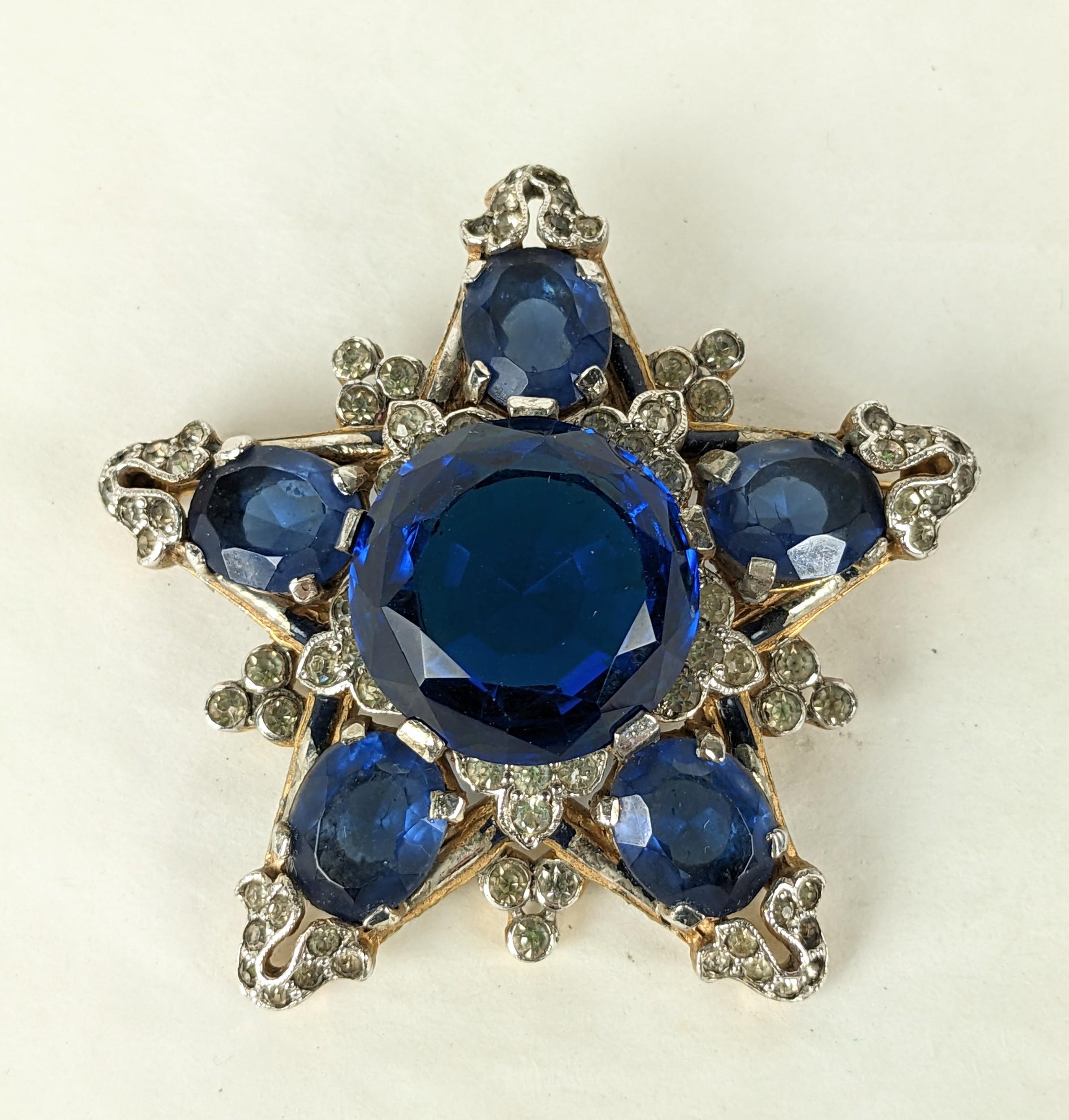 Attractive Trifari Eugenie Star Brooch of faux oval sapphires with navy enamel and pave accents. Alfred Phillipe for Trifari 1930's. 2.25