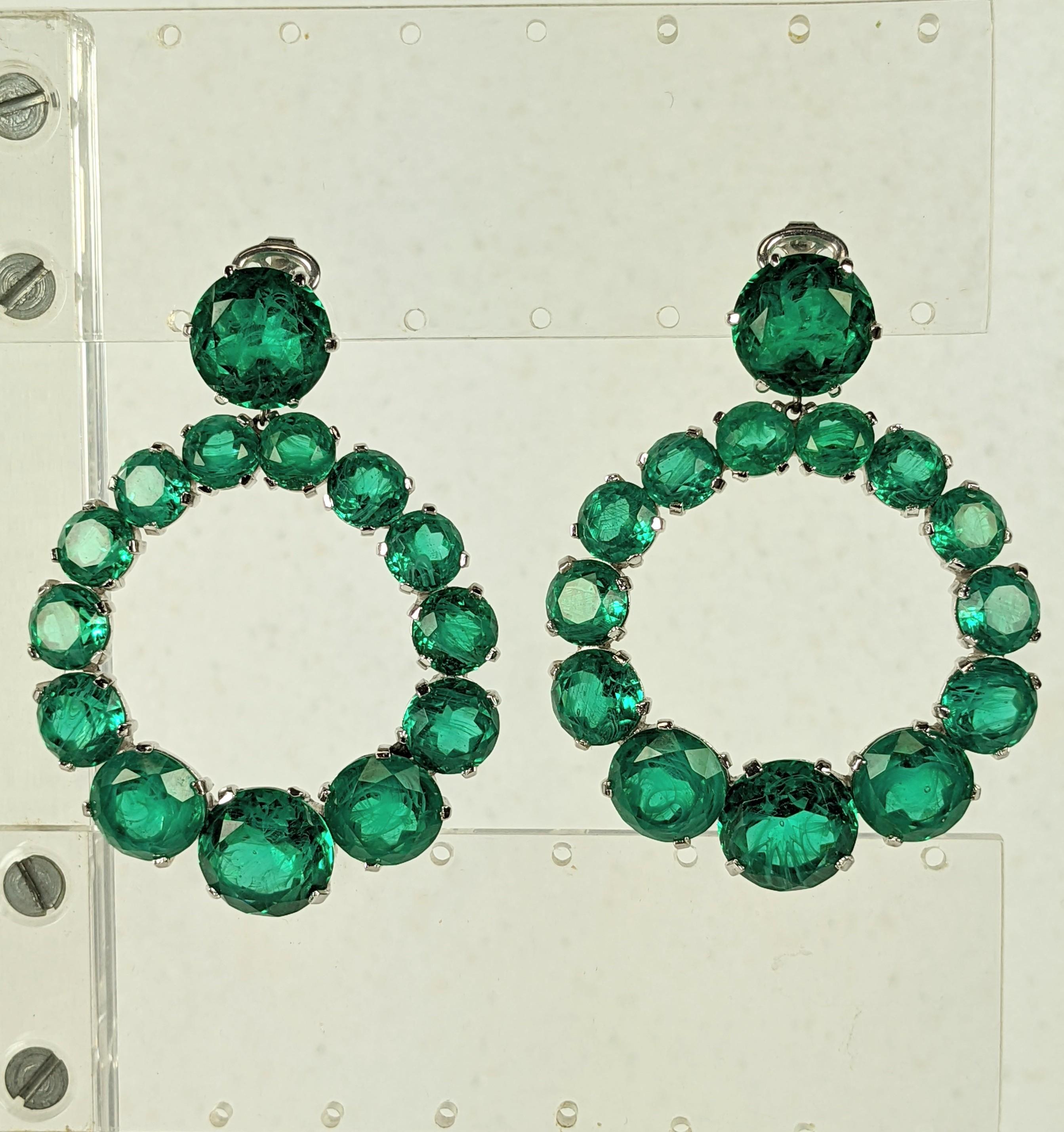 Exceptional Trifari Faux Emerald Hoop Earrings from the 1960's. Finest quality faux jewelry by the best maker of the period with glass stones simulating flawed emeralds in graduated sizes.
Clip back fittings, super striking scale and quality. 2.5