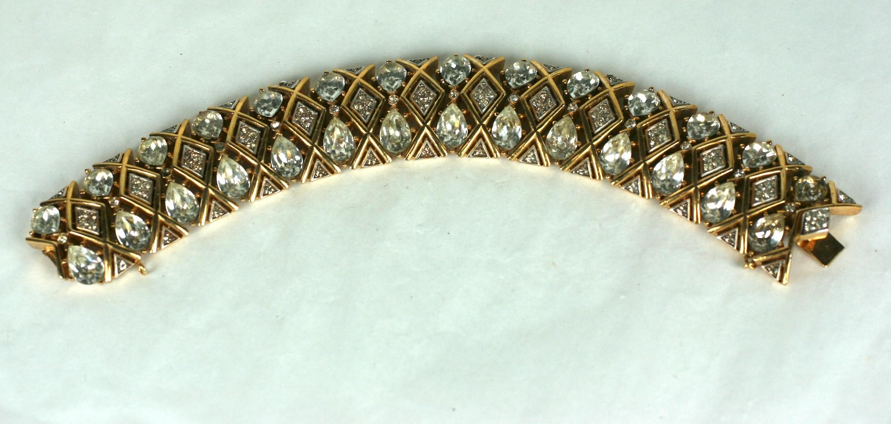 Trifari Glamour Rhinestone Bracelet set with large pear shaped crystals with pave accents. Very flexible and comfortable articulated construction set in gilt metal.  1960's USA. 
7.5