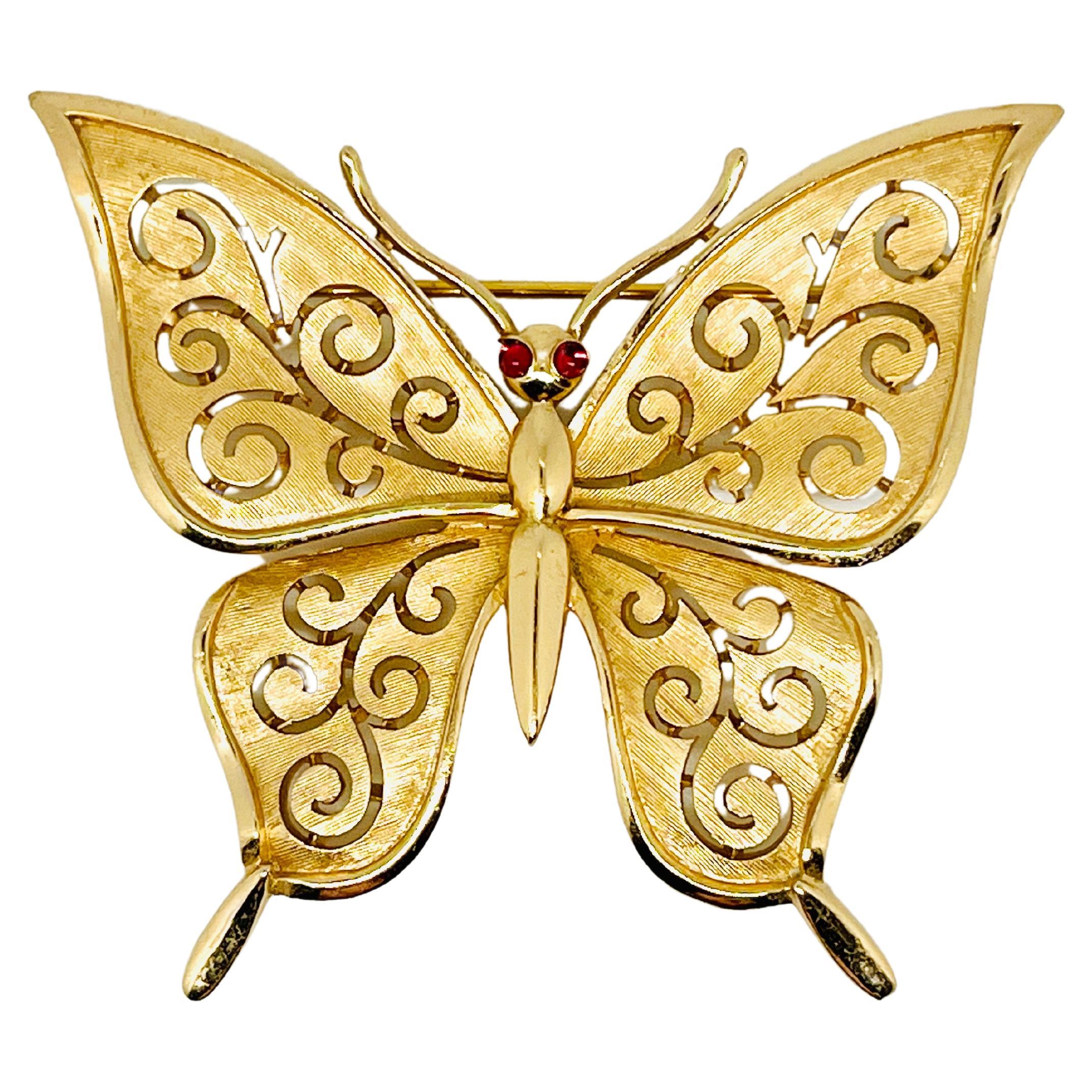 Trifari Gold Florentine Butterfly Brooch, Garnet Cabochon Eyes, Swirl Detail  For Sale