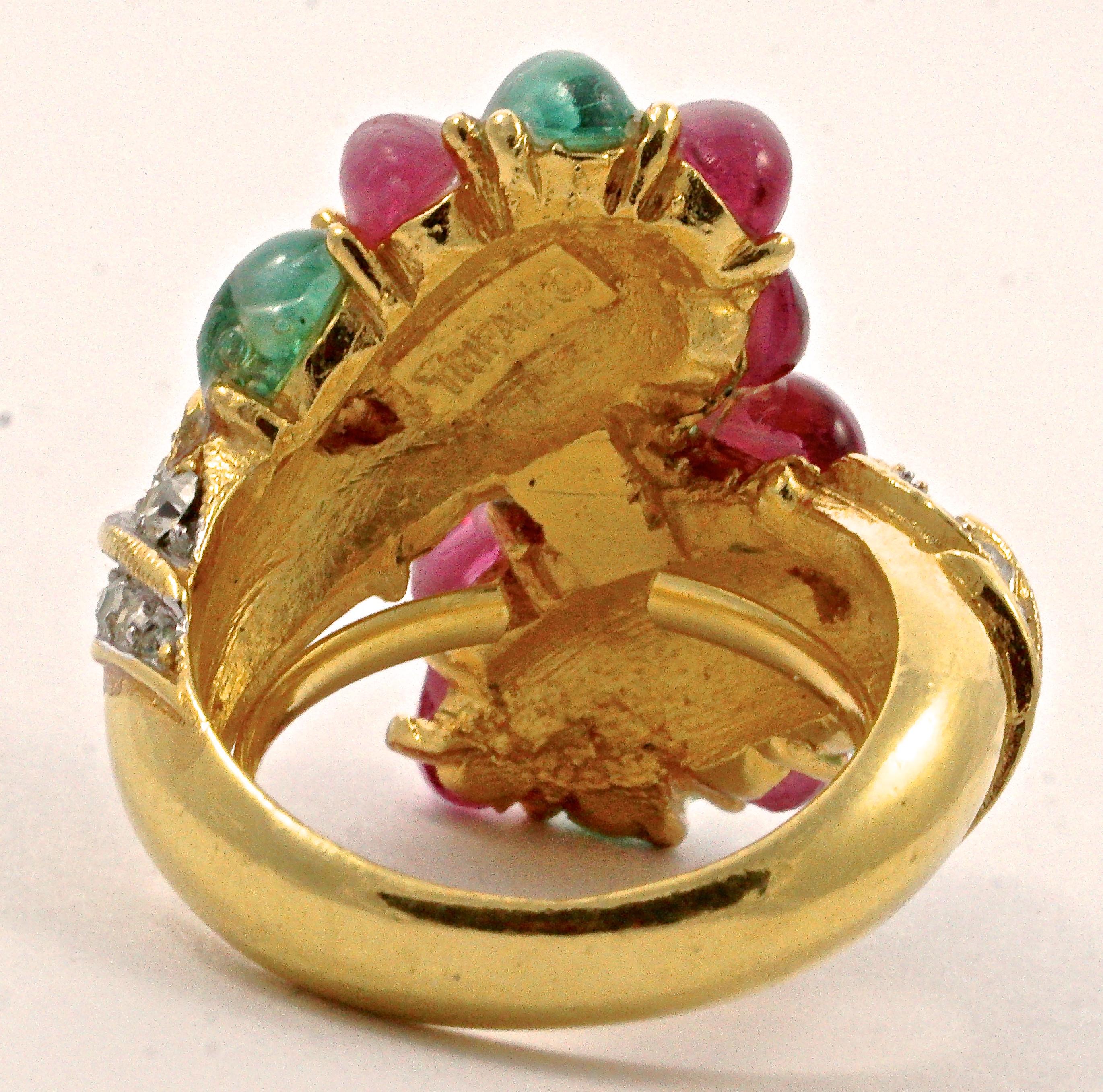 Beautiful Trifari gold plated ring, featuring clusters of dark pink and green oval glass cabochons with white swirls, and embellished on the shoulders with clear rhinestones. Ring size UK L 1/2, US 5 7/8, inside diameter 1.7cm / .67 inch, and the