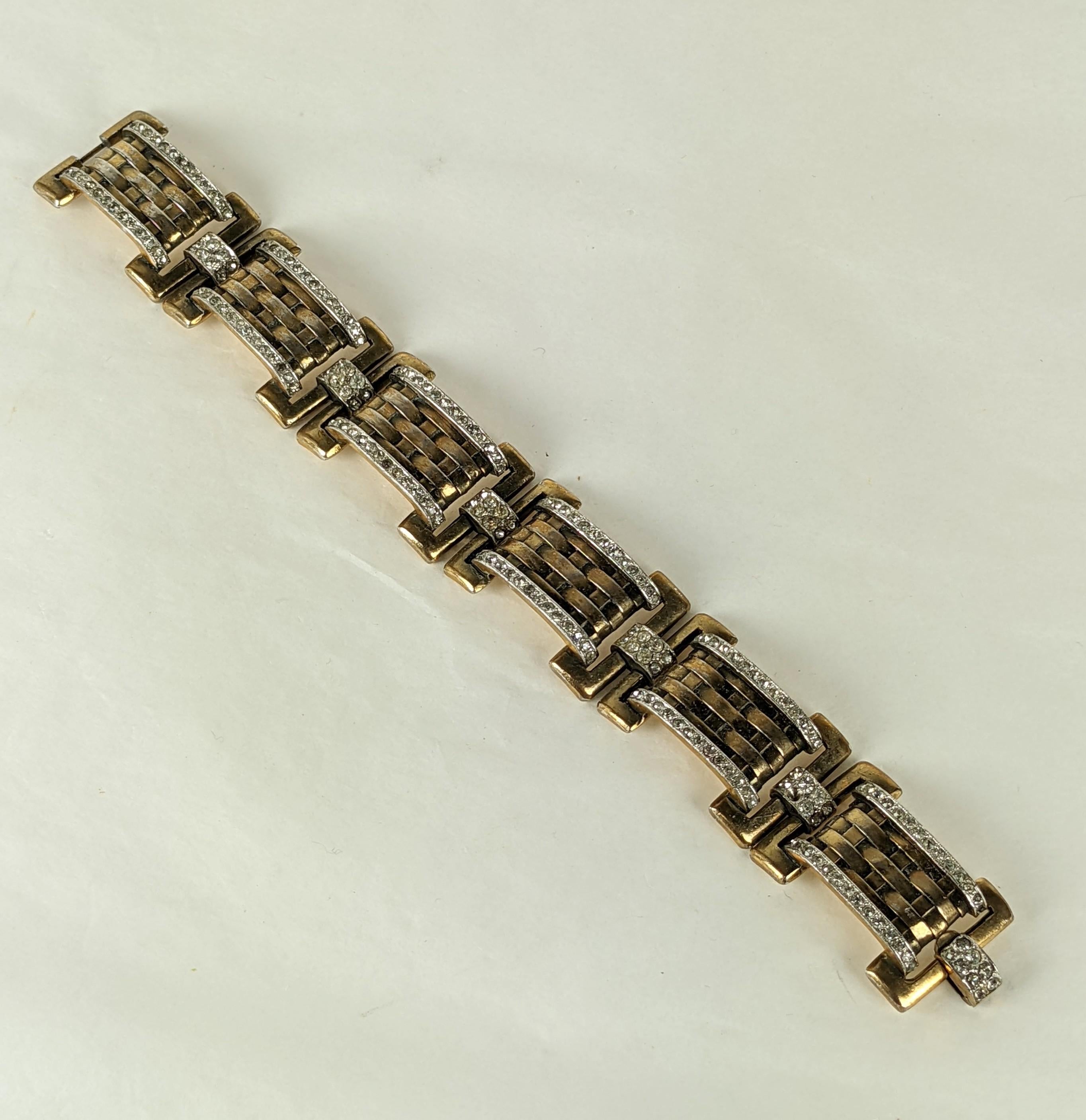 Trifari by Alfred Phillipe Green Gold Plated Pave Link Retro Bracelet from the 1940's. Basketweave pattern on each link with pave rhinestone edges and connectors. 1940's USA. 
7.5