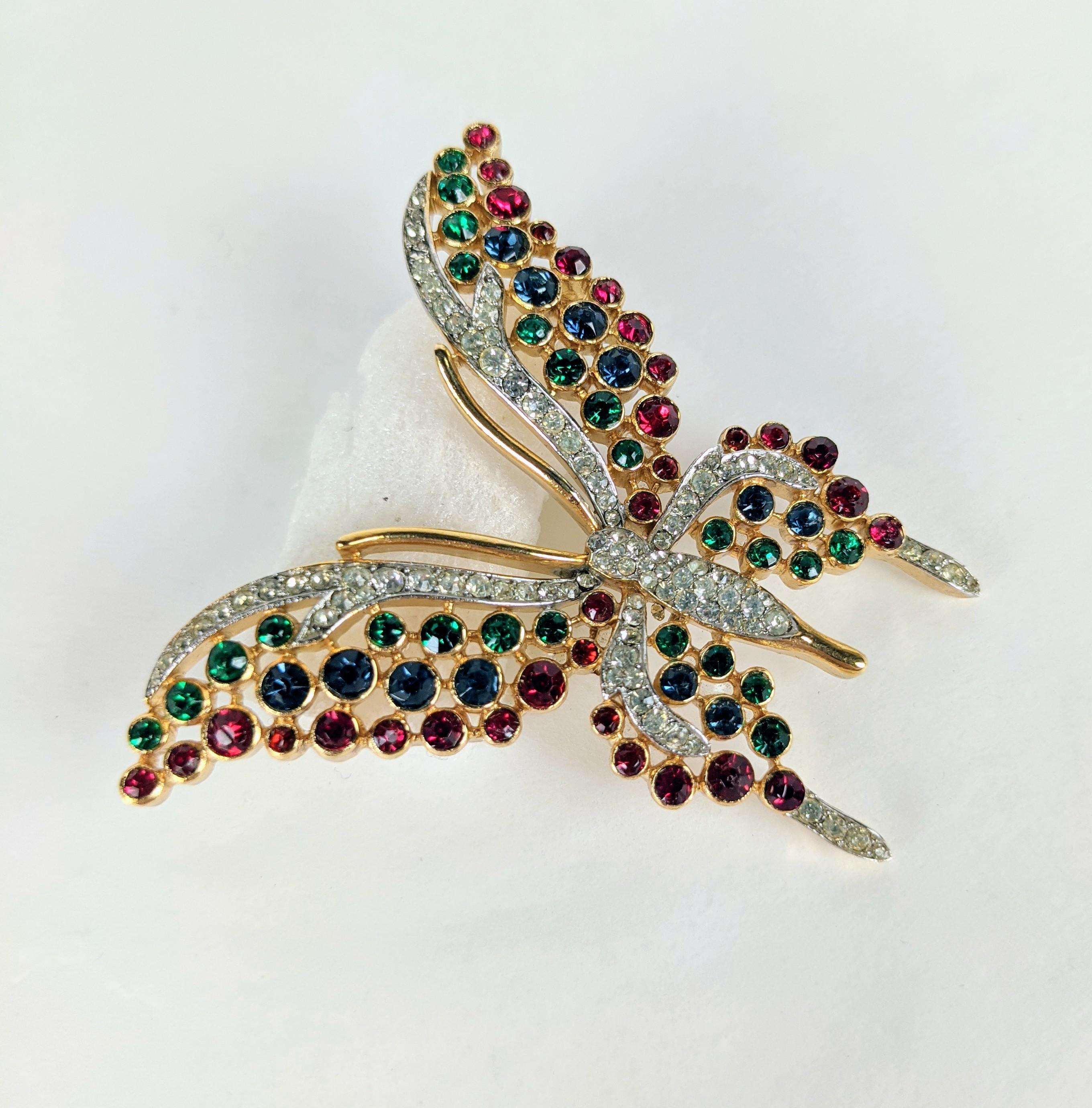 Charming Trifari Jeweled Crystal Butterfly in tones of ruby, sapphire and emerald. 
1950's USA.   2.5