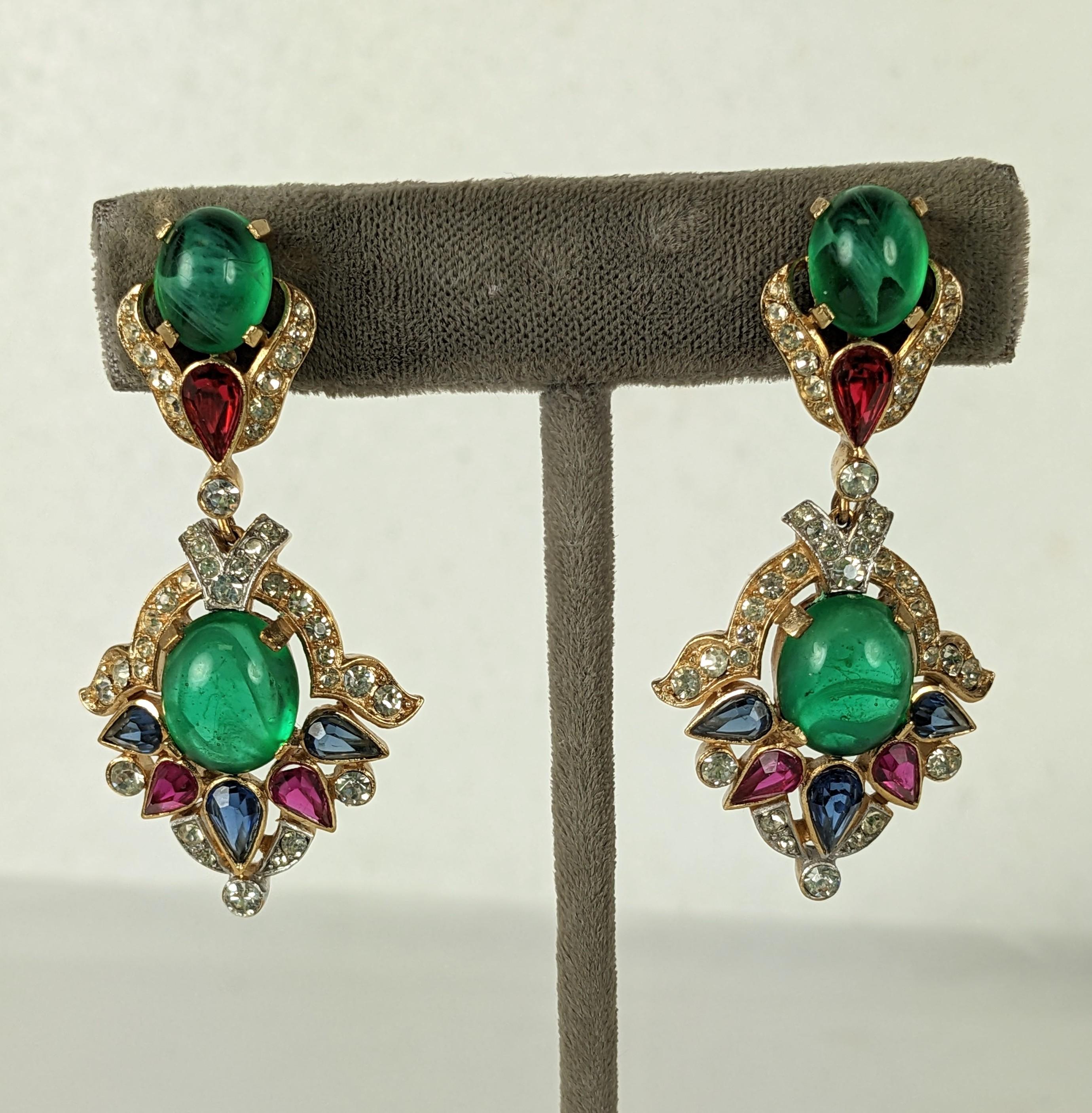 Rare Trifari Jewels of India Earrings from the Moghul series. Elaborate pave crystal stone work set in both gilt and rhodium metal with cabochon stones in jewel tones. 
1960's USA. 2