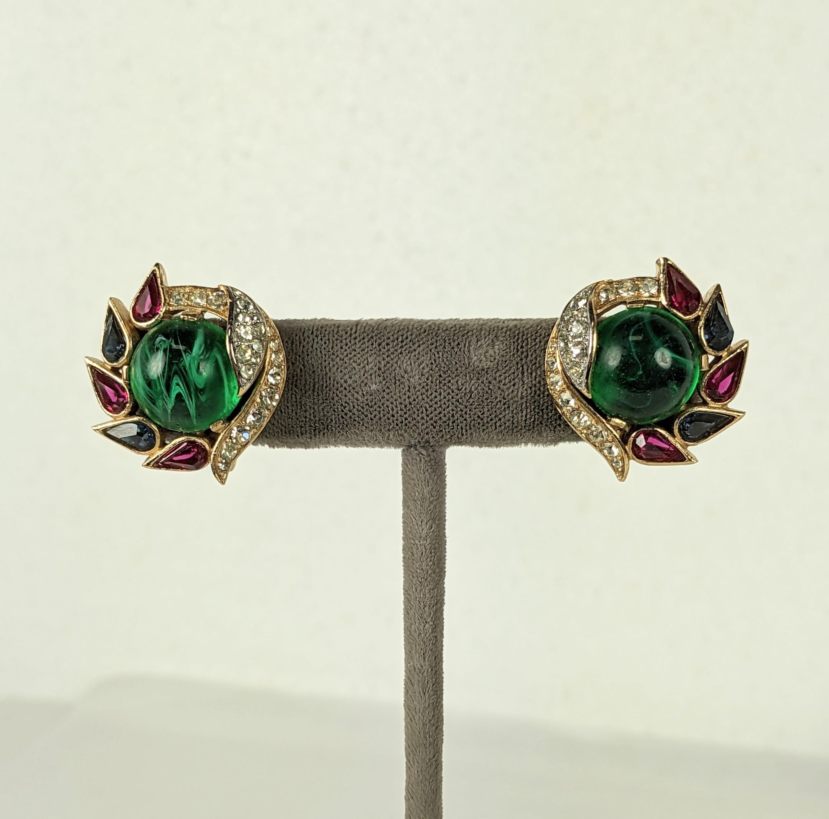Rare Trifari Jewels of India Earrings from the Moghul series. Elaborate pave crystal stone work set in both gilt and rhodium metal with cabochon stones in jewel tones.
1960's USA.  1