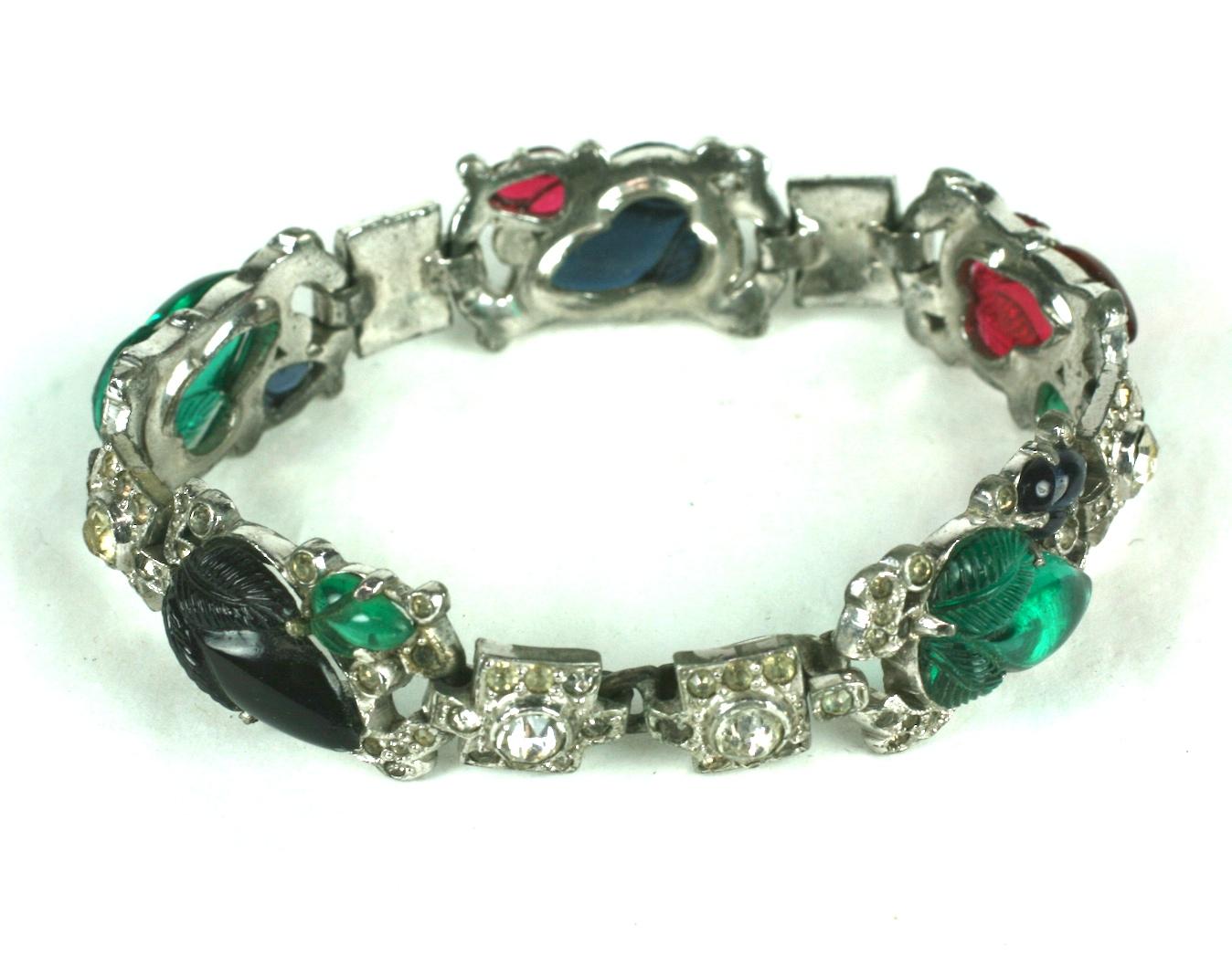 KTF Trifari Alfred Philippe five link tricolour fruit salad  bracelet. Rhodium plate base metal, crystal rhinestones, and tri color pressed glass hand polished fruit salads. 
A version of this bracelet can be found in Brunialti, American Costume