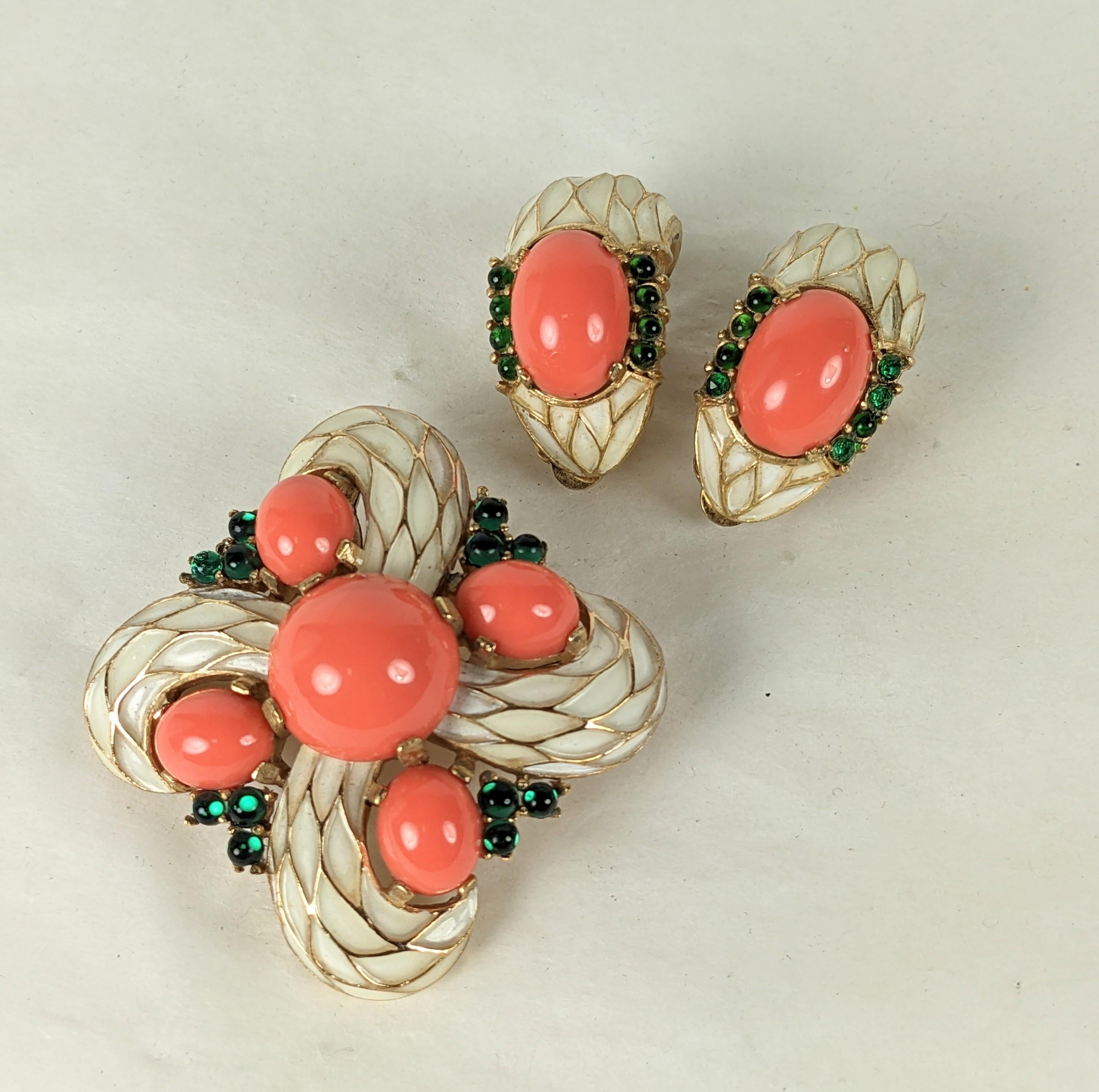 Trifari L'Orient Series Brooch and earring set from the 1960's. Done in a David Webb style with faux cab coral and emeralds with enamel. 
Crest brooch and clip earrings. 1960's USA, Brooch 2
