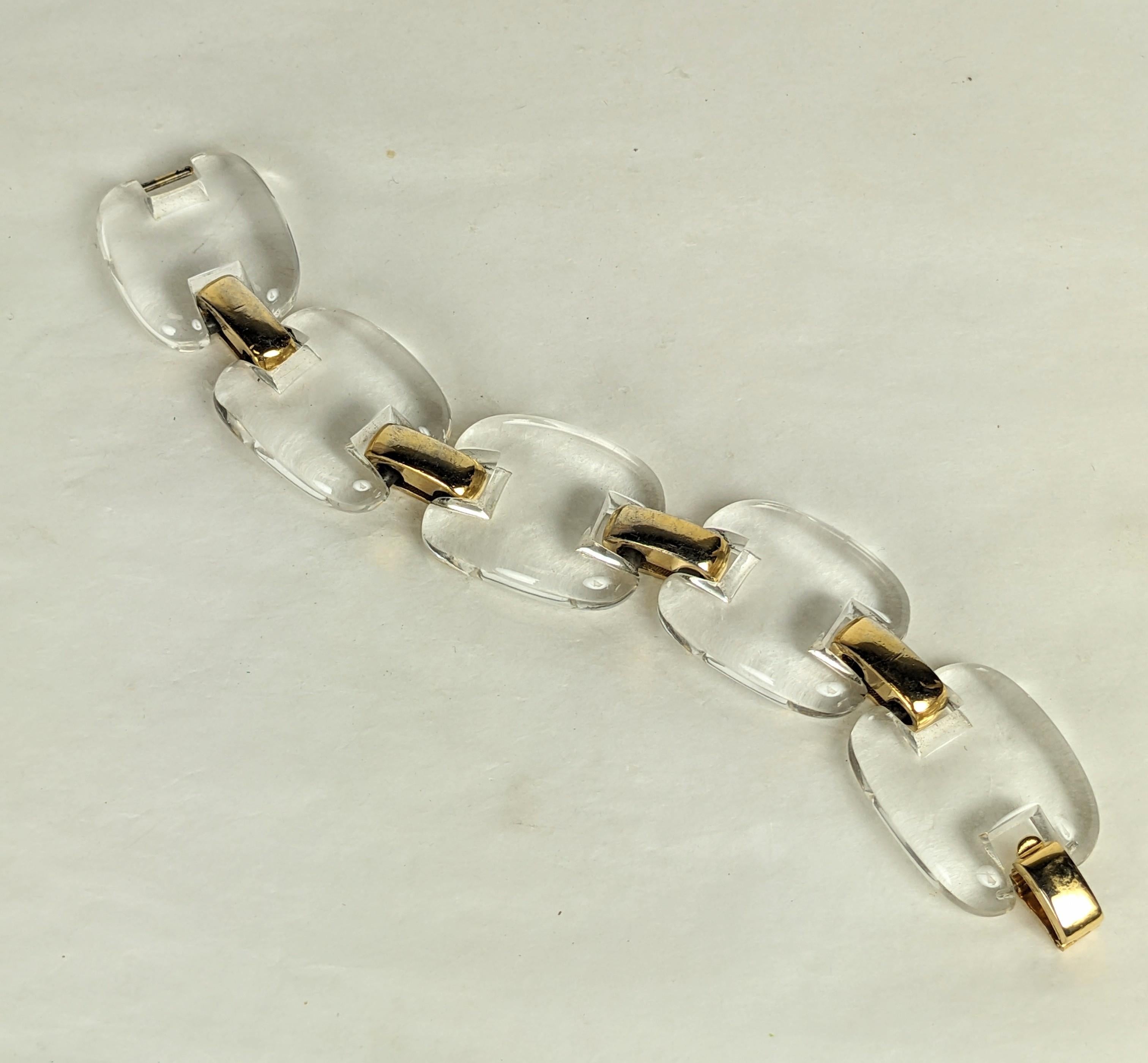 Elegant Trifari Lucite Link Modernist Bracelet from the 1960's. Molded lucite links with gilt metal links. Signed Trifari. 7.5