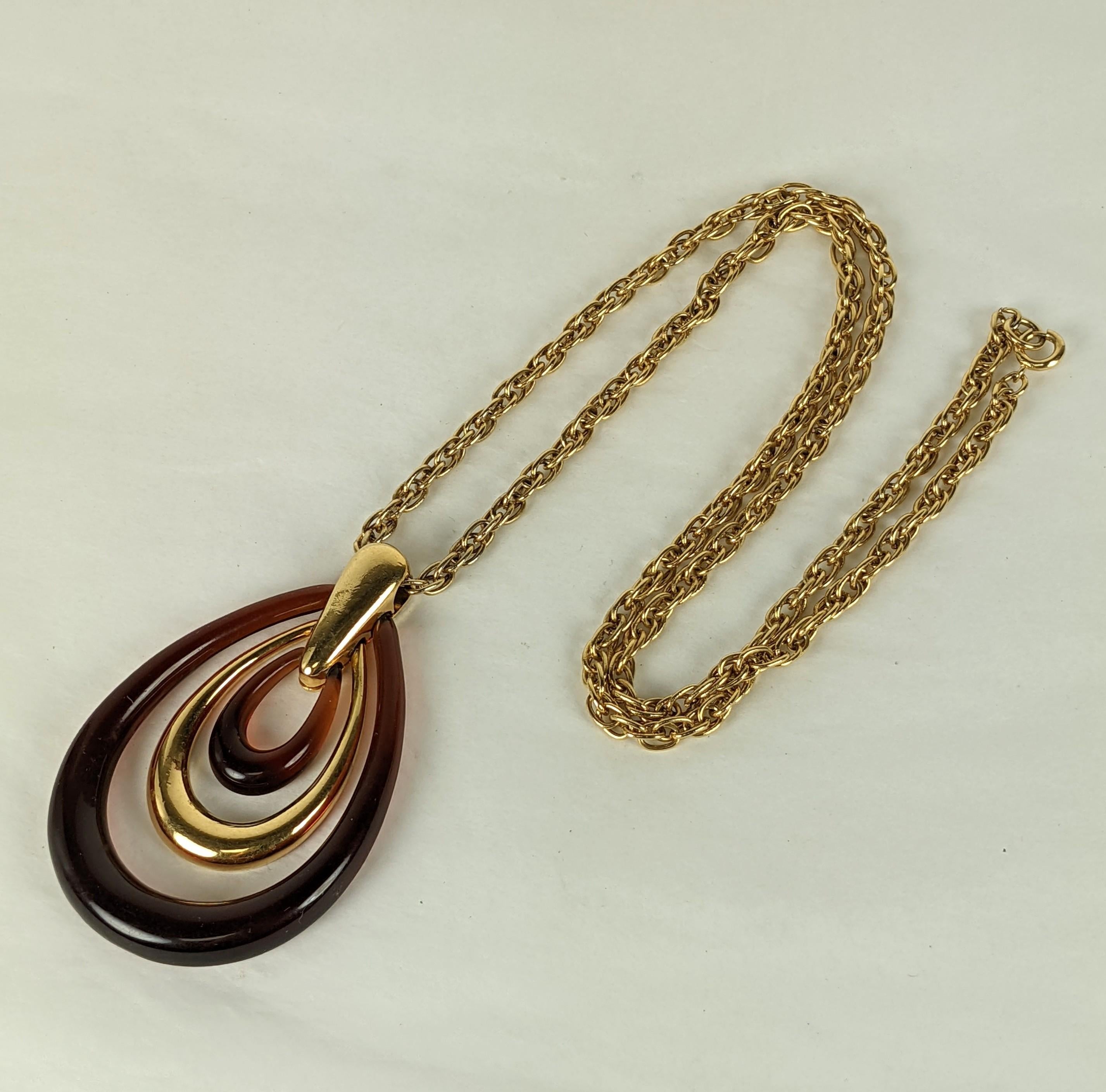 Trifari Mod Faux Tortoise Hoop Pendant from the 1970's. Graduated tortoise plastic and gilt hoops hand from a thick textured chain. Signed Trifari. Pendant 3