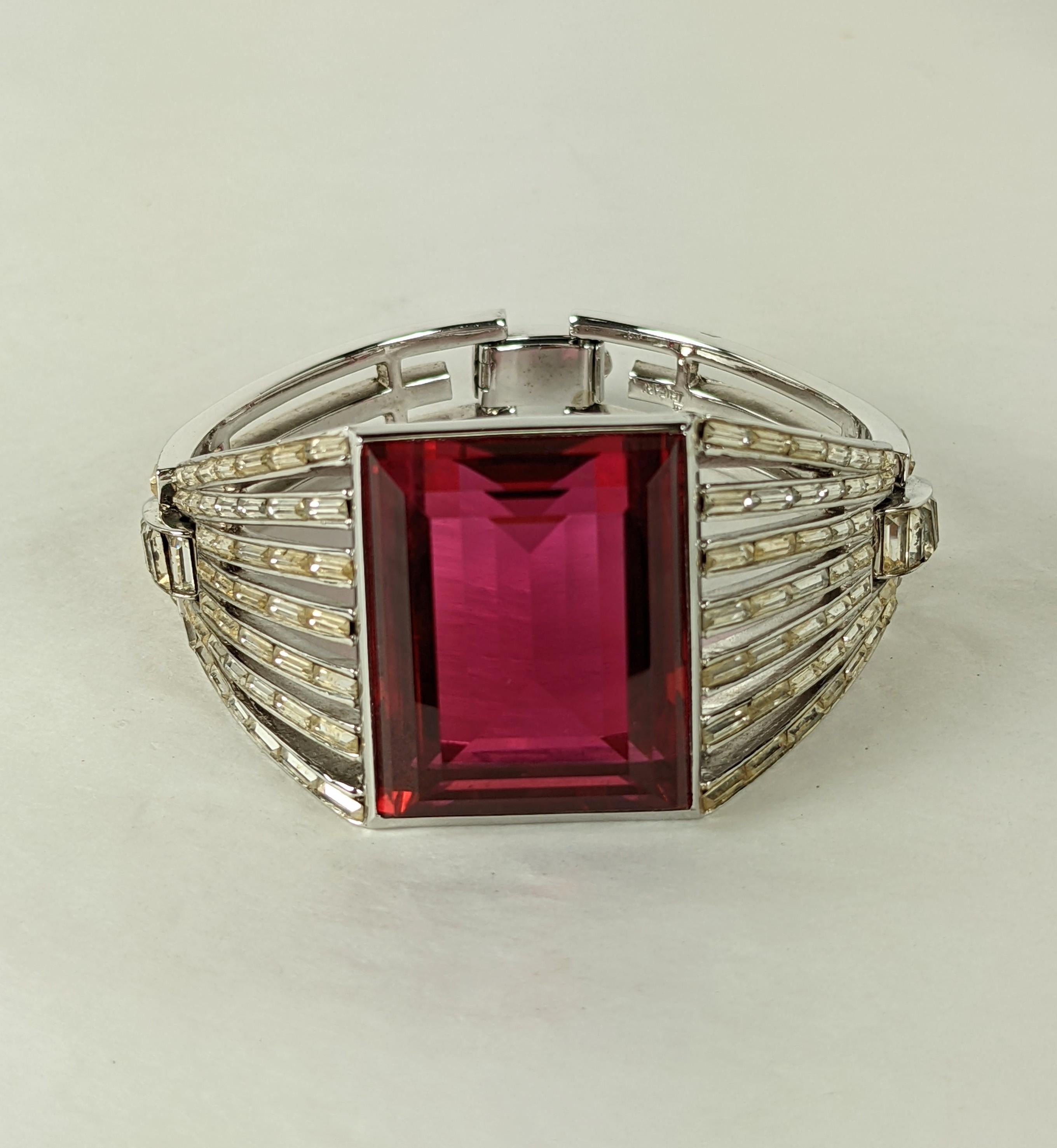 Wonderful and rare Trifari 'Alfred Philippe' 'Monte Cristo' Series Giant Square Cut Faux Ruby and Diamante Baguettes Sunburst Cuff from the 1950's. Hinged at the sides with dozens of crystal baguettes fanning out from central stones all the way to