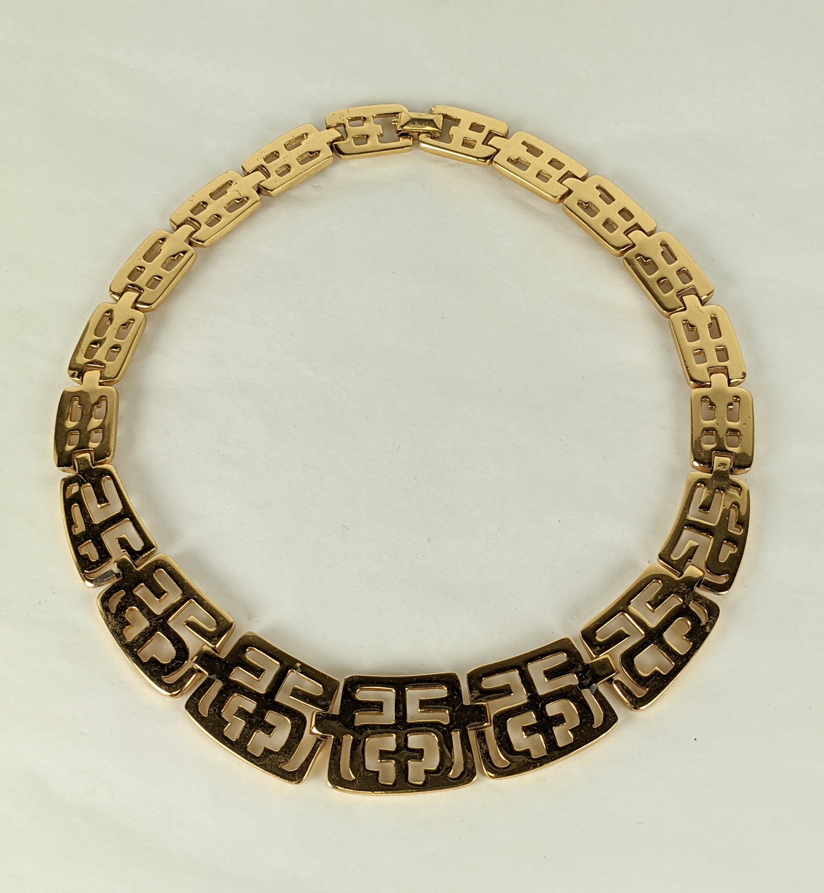 Elegant Trifari Pierced Gold Collar from the 1970's with graduated links. Pierced designs of abstract symbols.  Length 17