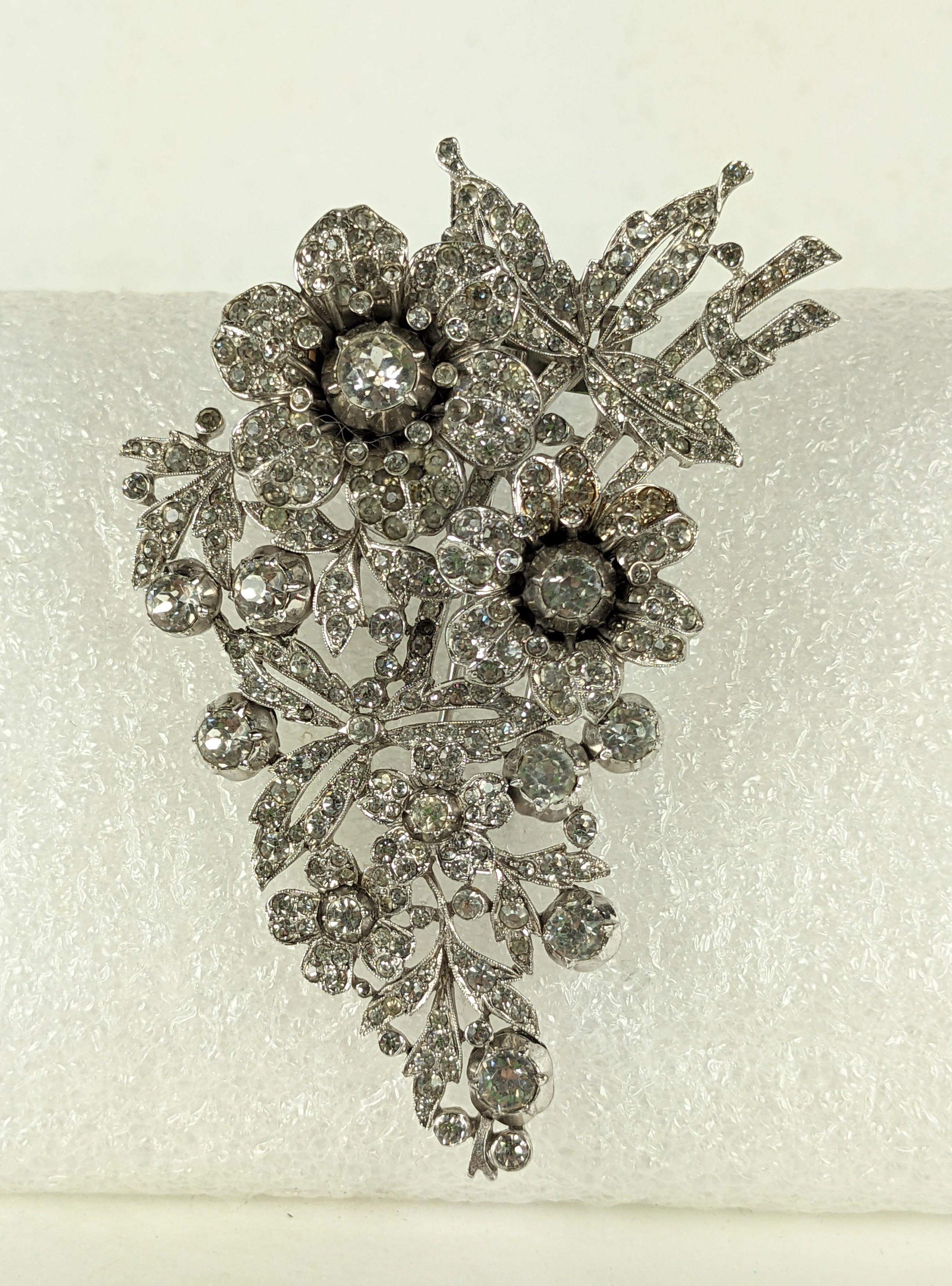 Rare Trifari Regence Series Tremblant Pave 18th Century Clip Brooch set in rhodium from the 1930's by Alfred Philippe. 2 pave set flowerheads are set on tremblers to move with wearer, set in an elaborate 18th Century floral diamond style. 3.5