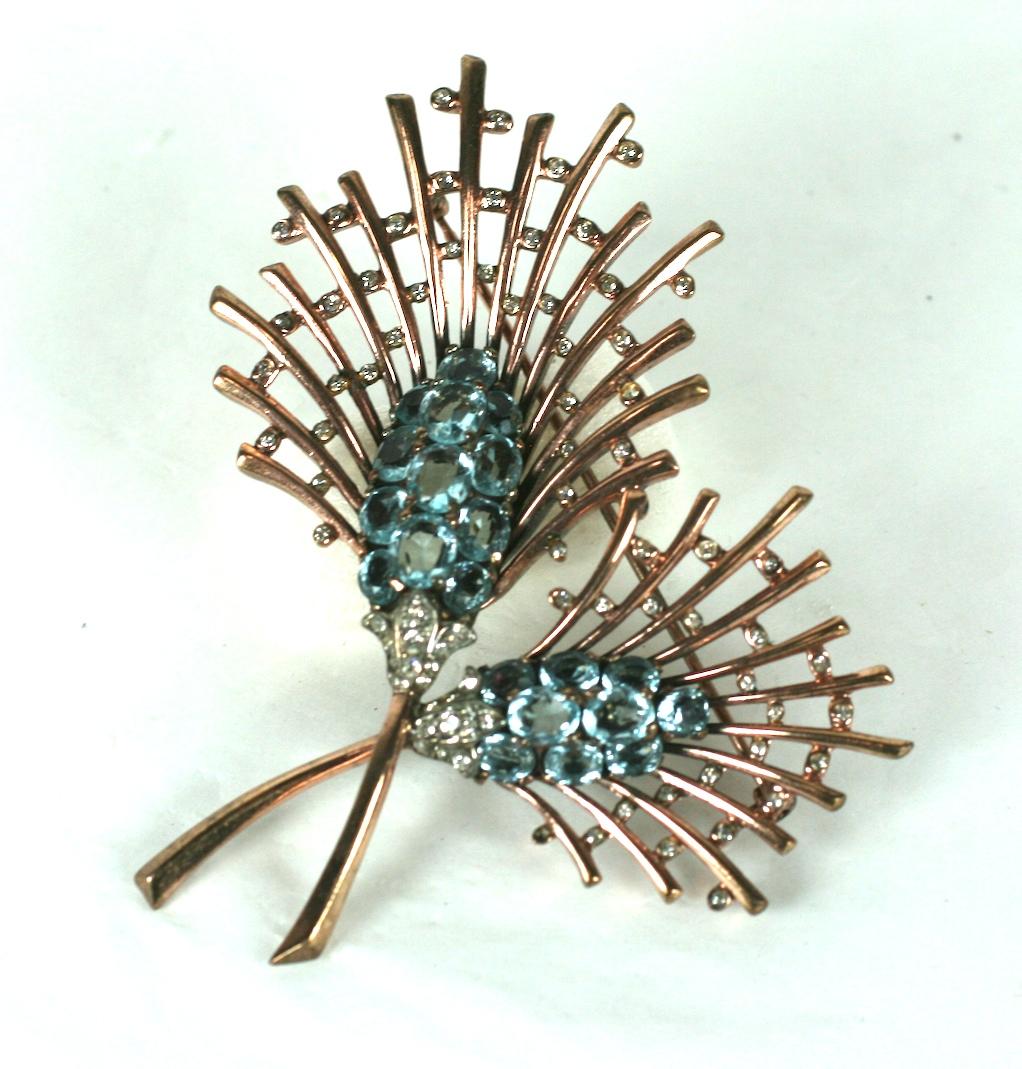 Elegant Trifari Retro Faux Aquamarine spray in rose gold plated sterling by Alfred Phillipe. Double spray design with pale blue oval stones accented with pave accents. 1940's USA.
Excellent condition.  3