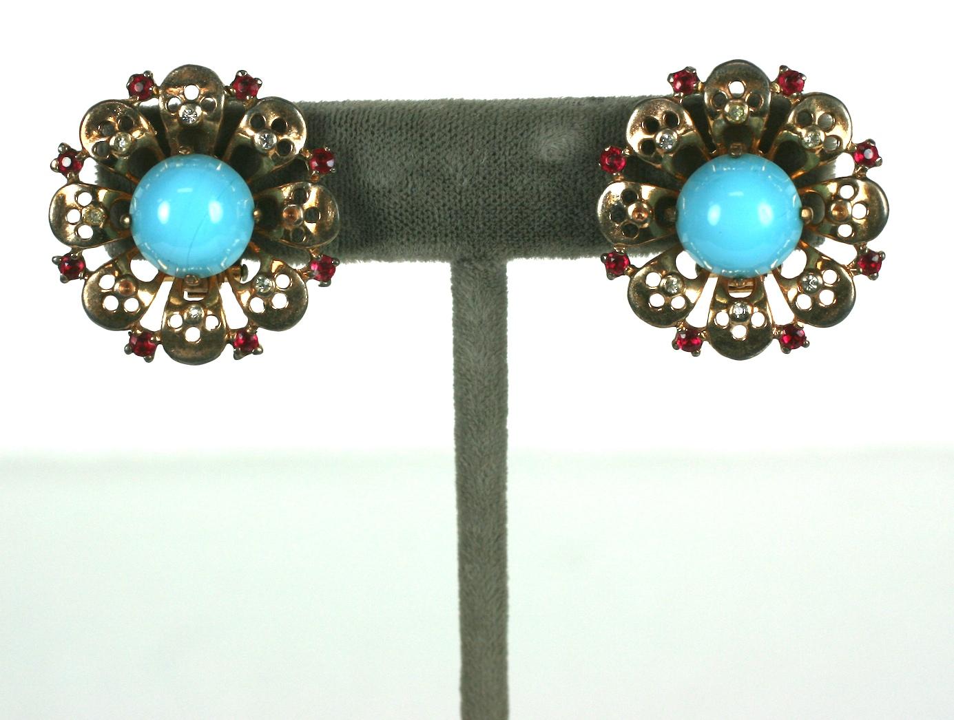 Trifari Retro Sterling Turquoise Earrings from the 1940's. Retro pierced design with faux cab turquoise and ruby pastes by Alfred Phillipe. Vermeil pink gold finish. 
Clip fittings. Matching brooch available. 4.25