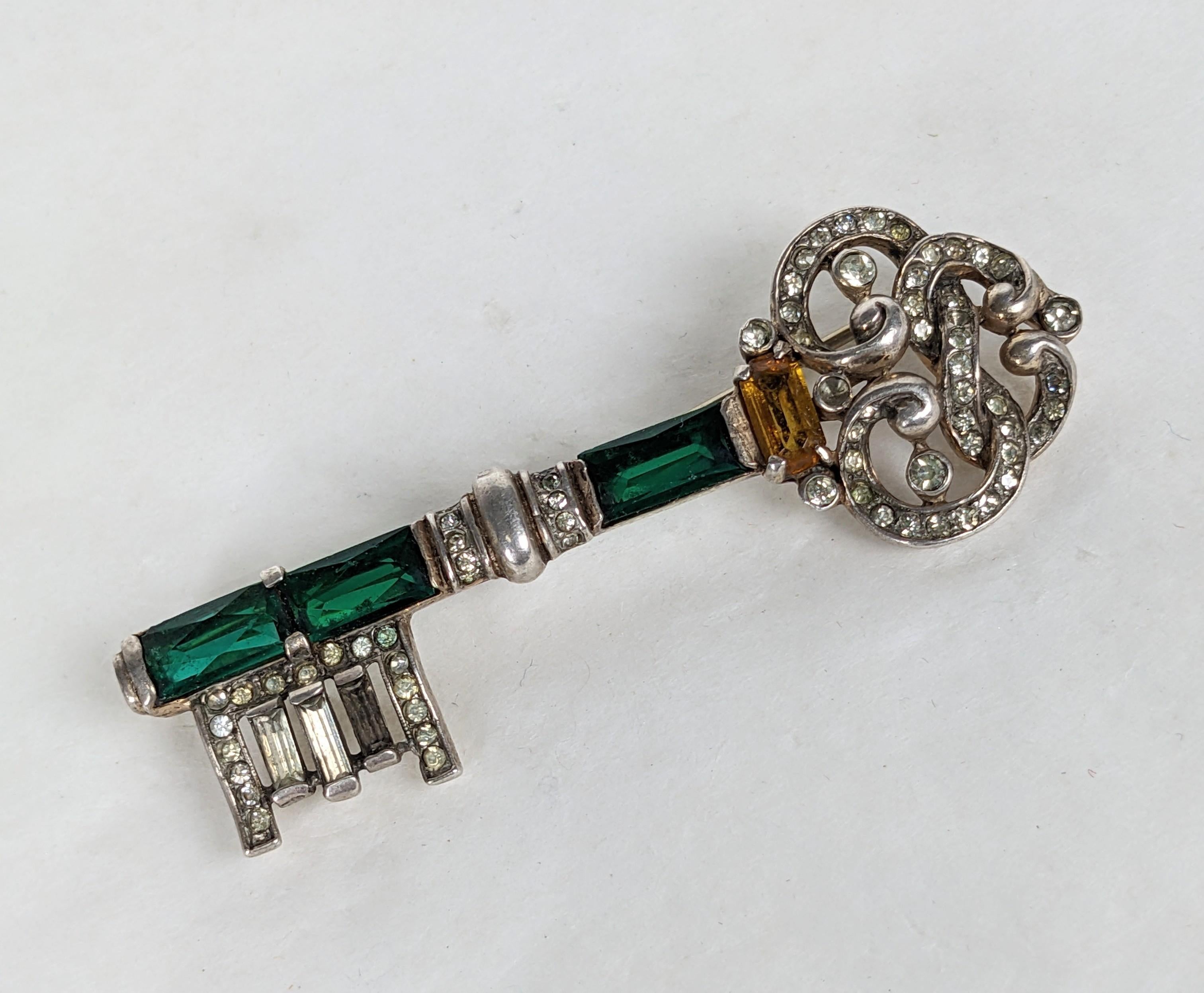 Trifari Sterling Vermeil Jeweled Key Brooch by Alfred Philippe from the 1940's with emerald and citrine crystals. 2.6