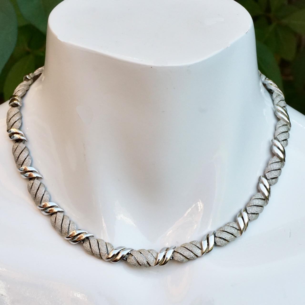 Beautiful Trifari silver plated brushed and shiny link design necklace. Length 39.7 cm / 15.6 inches by width 8 mm / .3 inch. The necklace has a double link clasp, allowing a link to be removed to make the necklace shorter. The necklace is in very