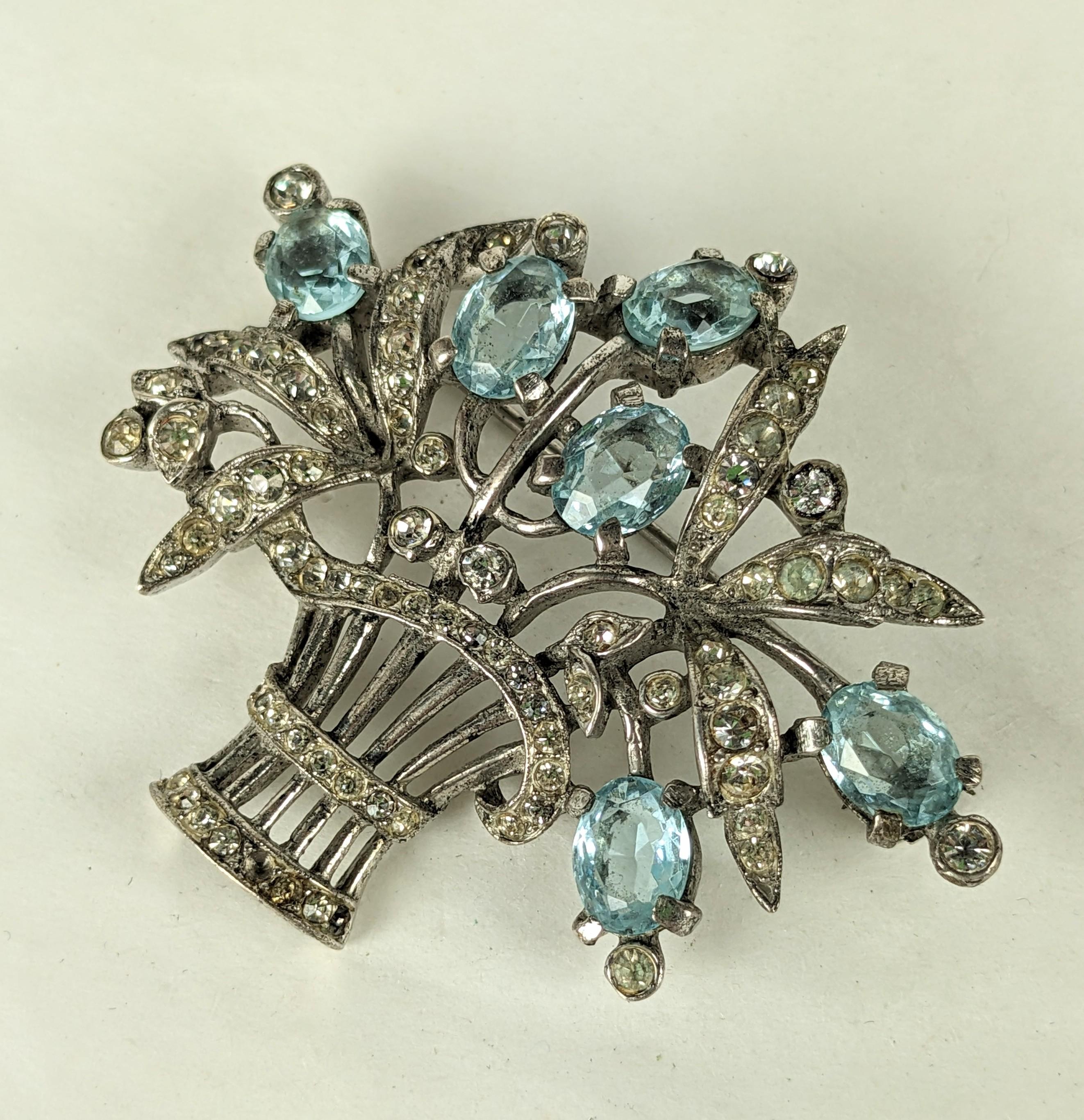 Elegant Trifari Sterling Aqua Giardinetto Brooch from the 1930's by Alfred Phillipe. Set in sterling with crystals and aqua pastes in a flower basket motif. 1930's USA. 2