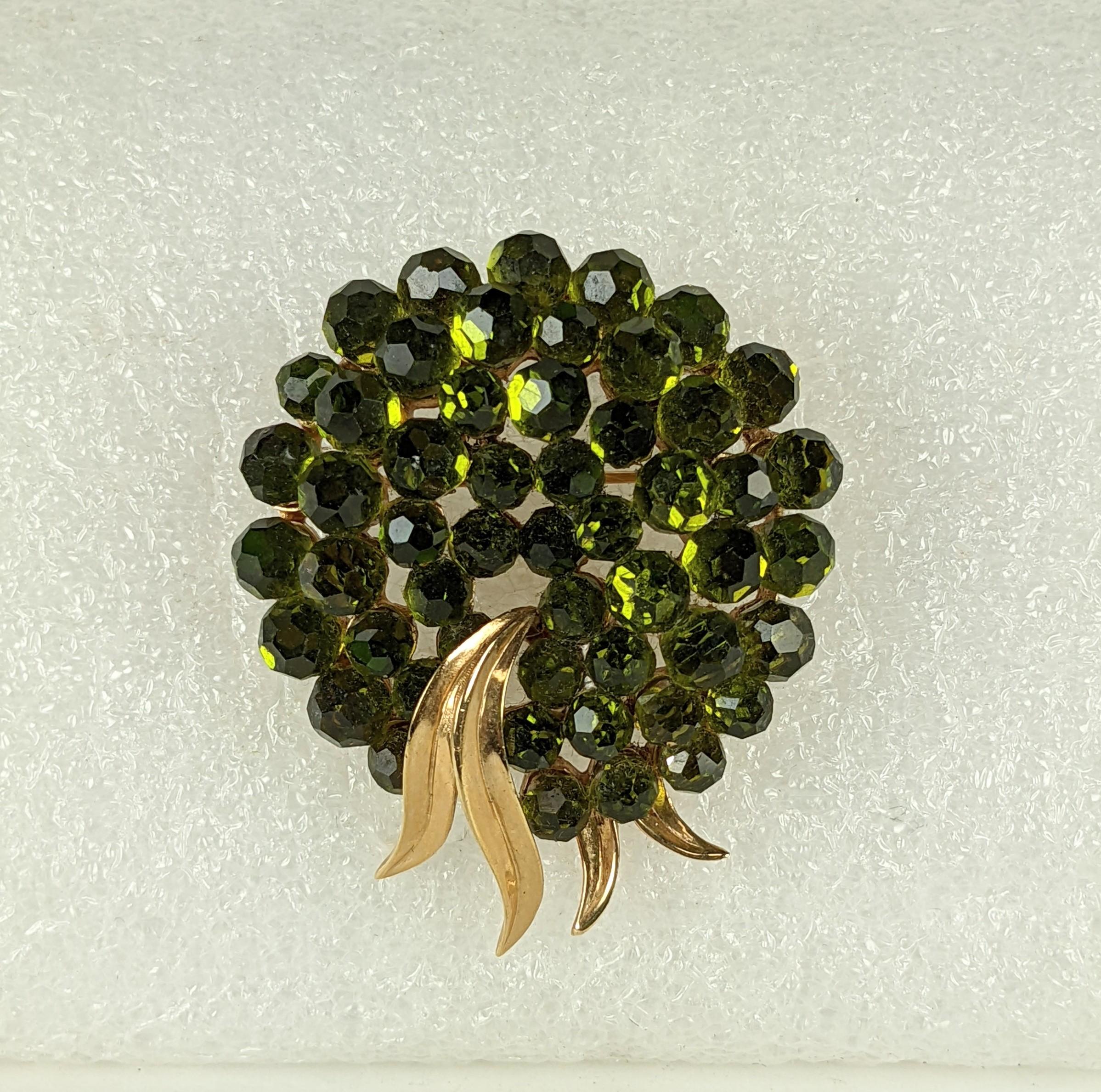 Striking Trifari Swarovski Crystal Olivine Bead Brooch from the 1960's. Dozens of faceted olive crystal balls are set into the body of the brooch.  2