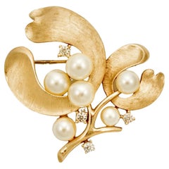 Trifari Textured Gold Plated Faux Pearl and Rhinestone Floral Brooch circa 1960s