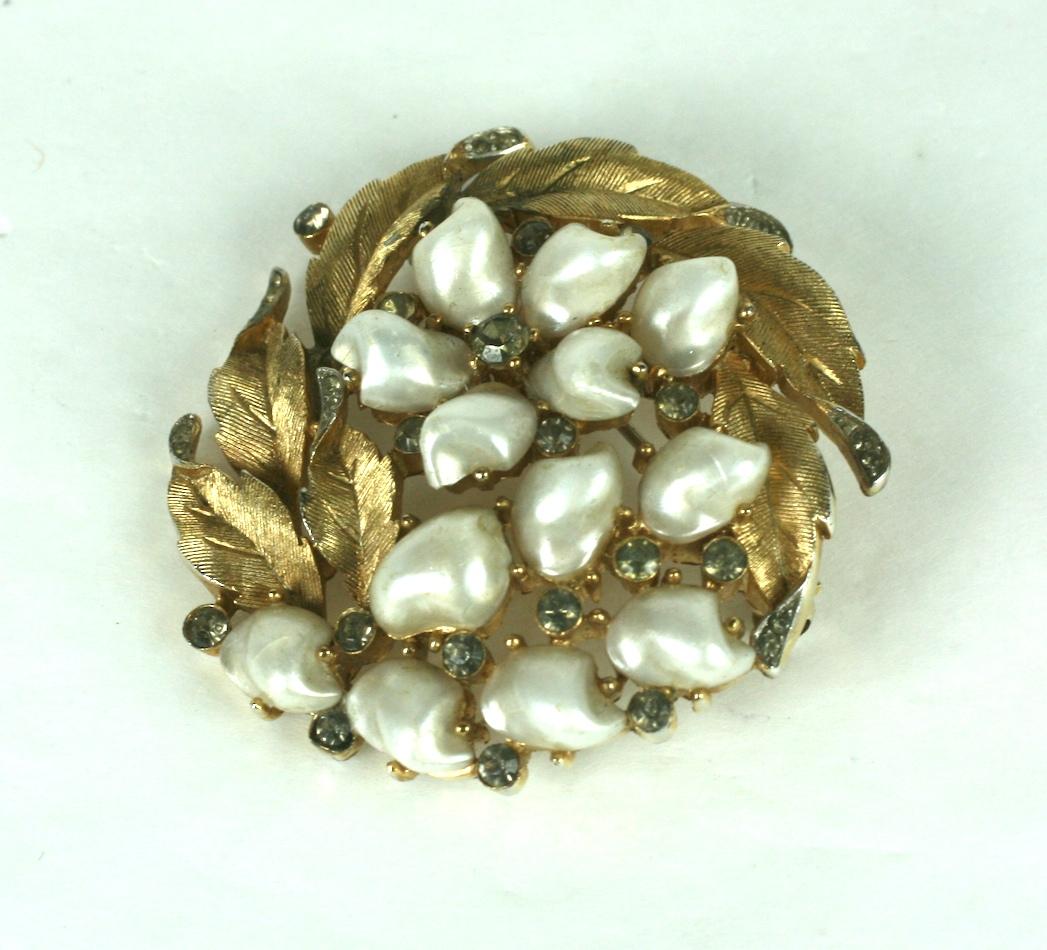 Trifari Tooth Pearl Brooch, Sorrentino Series from the 1960's in brushed gold finish, accented with smokey grey crystals and 
faux Mississippi pearls. 
1.75