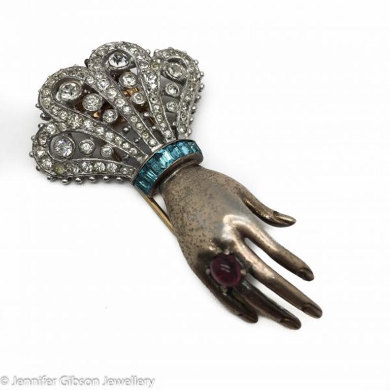 A Trifari Sterling Vermeil (Solid Sterling Silver with a gold wash) Hand Fur Clip dating to the year of 1944. The designer of this Trifari Sterling Hand Brooch is the legendary Alfred Philippe. HIs pieces for Trifari are the most sought after of the