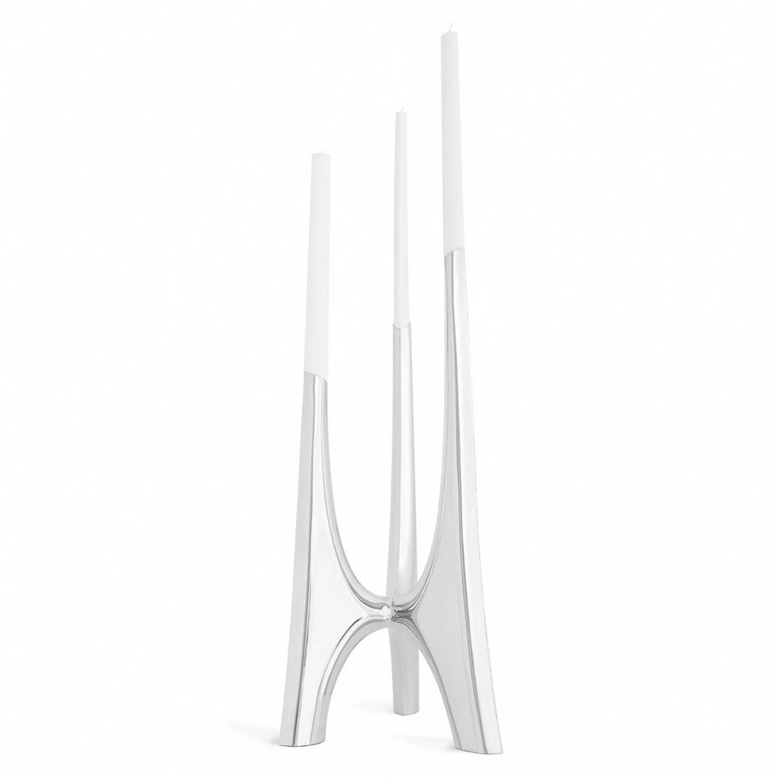 Triglav 83 Candleholder by Zieta
Dimensions: D 40 x W 40 x H 83 cm.
Material: Polished stainless steel. 

Also available in a smaller version. Candles included. Please contact us. 

Triglav is a steel candle holder from Zieta Studio, designed by