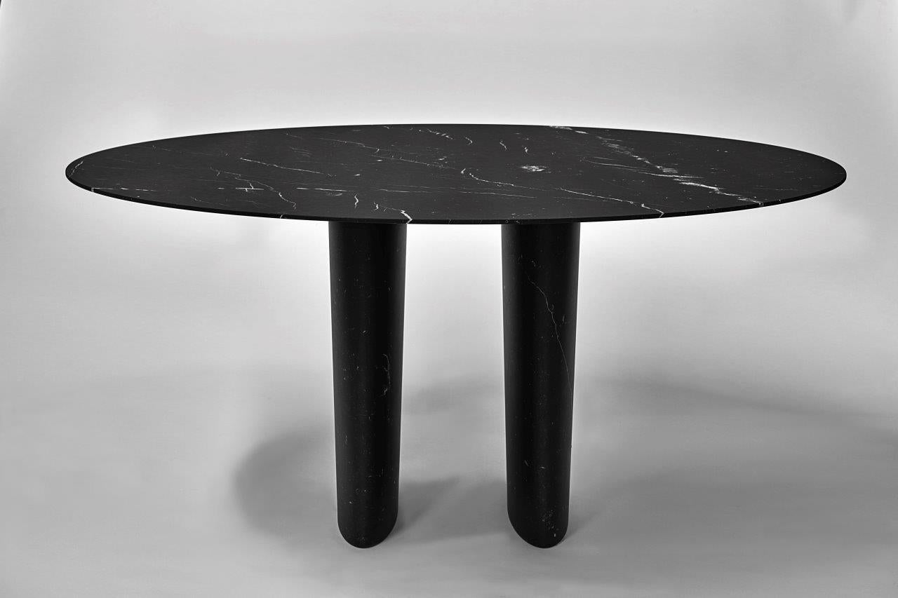 The trilite table is part of the newest table collection by Pibamarmi. The round top sits on two legs made of stone. Both top and legs are made of Nero Marquinia marble 
Customer can choose dimensions, shape and stones.