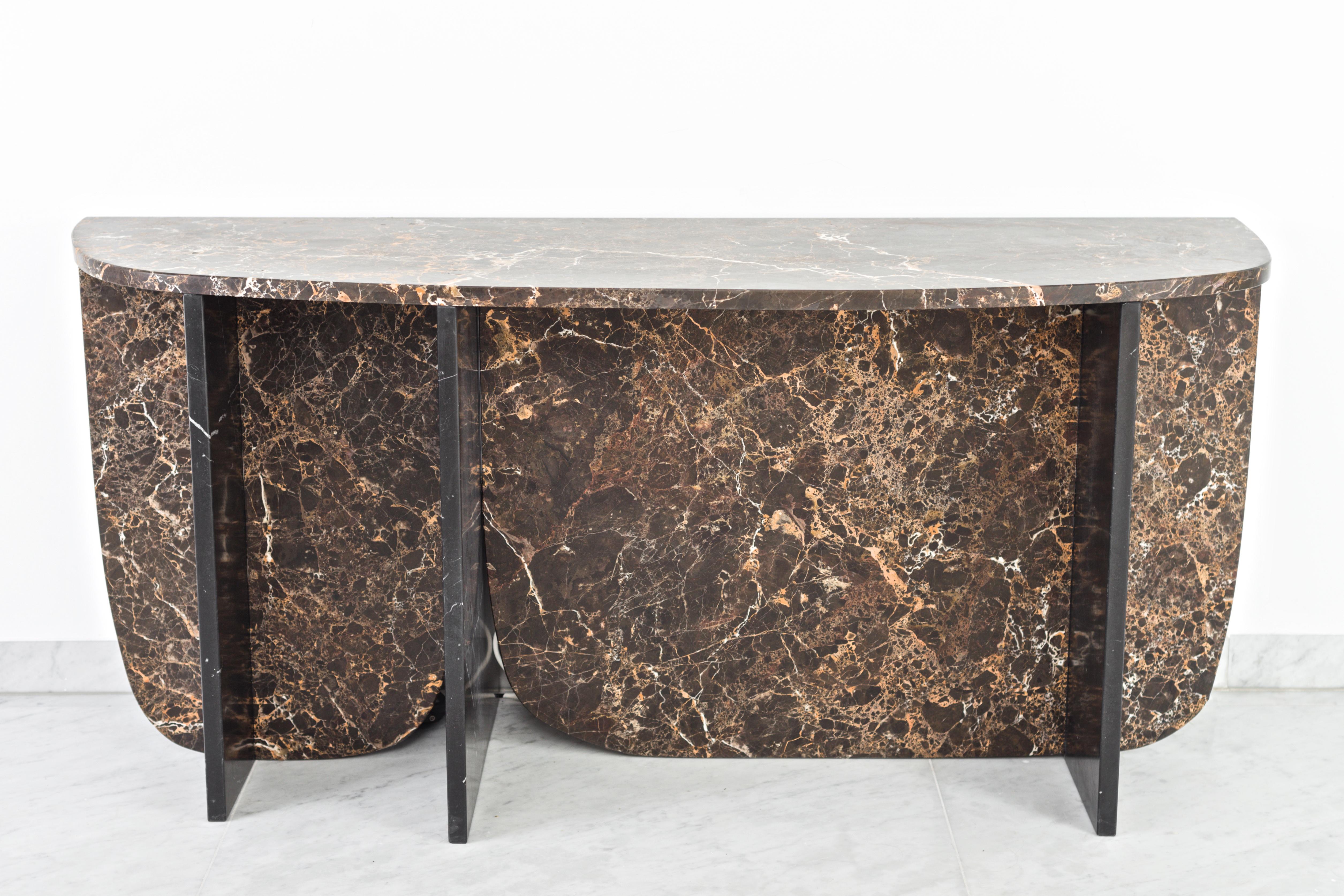 Trilithon marble console by OS And OOS
Dimensions: 180 x 59 x 81 cm
Materials: Emperador gold and nero marquina.


Studio OS And OOS is design studio for small objects to larger spatial concepts;
the studio tries to find the balance between