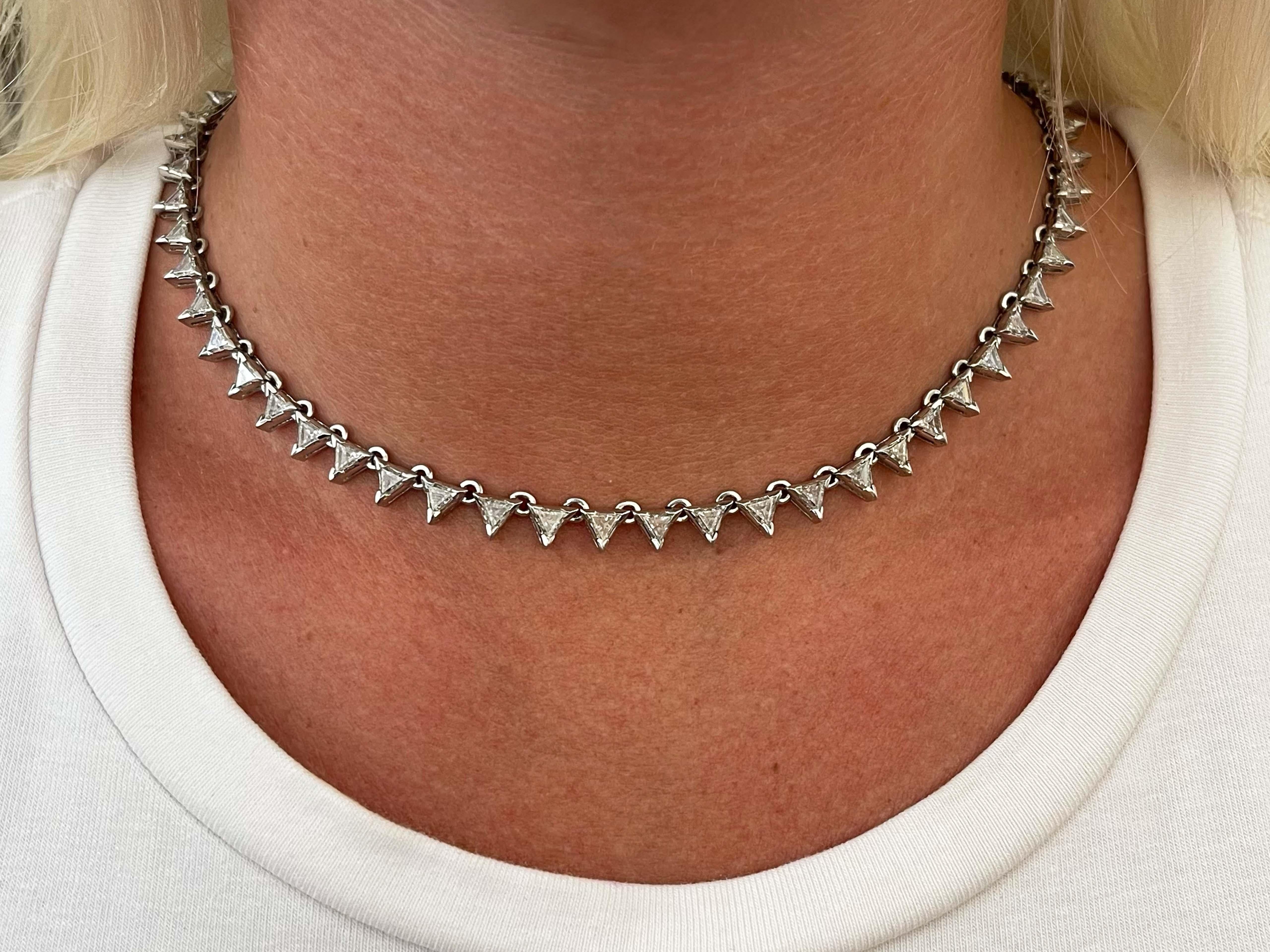 Item Specifications:

Style: Diamond Choker Necklace

Metal: Platinum

Total Weight: 40.1 Grams

Chain Length: 16 inch

Diamonds: 58 Trillion Diamonds

Total Diamond Weight: 9.72 Carats

Diamond Color: G-H

Diamond Clarity: VS1-VS2
​
​Closure: