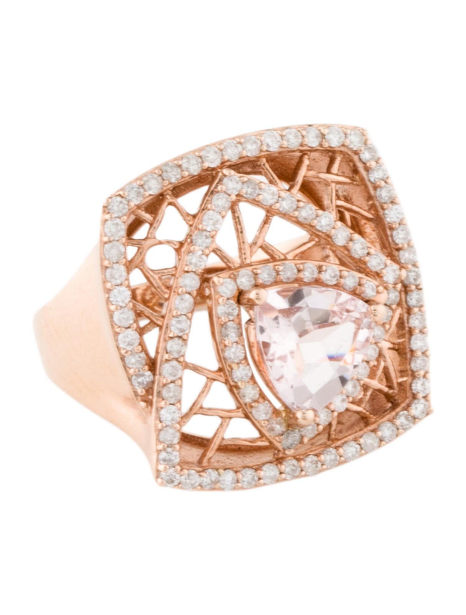 This is a gorgeous natural 1.31 carat morganite and diamond vintage ring set in solid 14K rose gold. The natural trillion cut morganite has excellent peachy color and is surrounded by a halo of round-cut white diamonds. The ring is stamped 14k and a