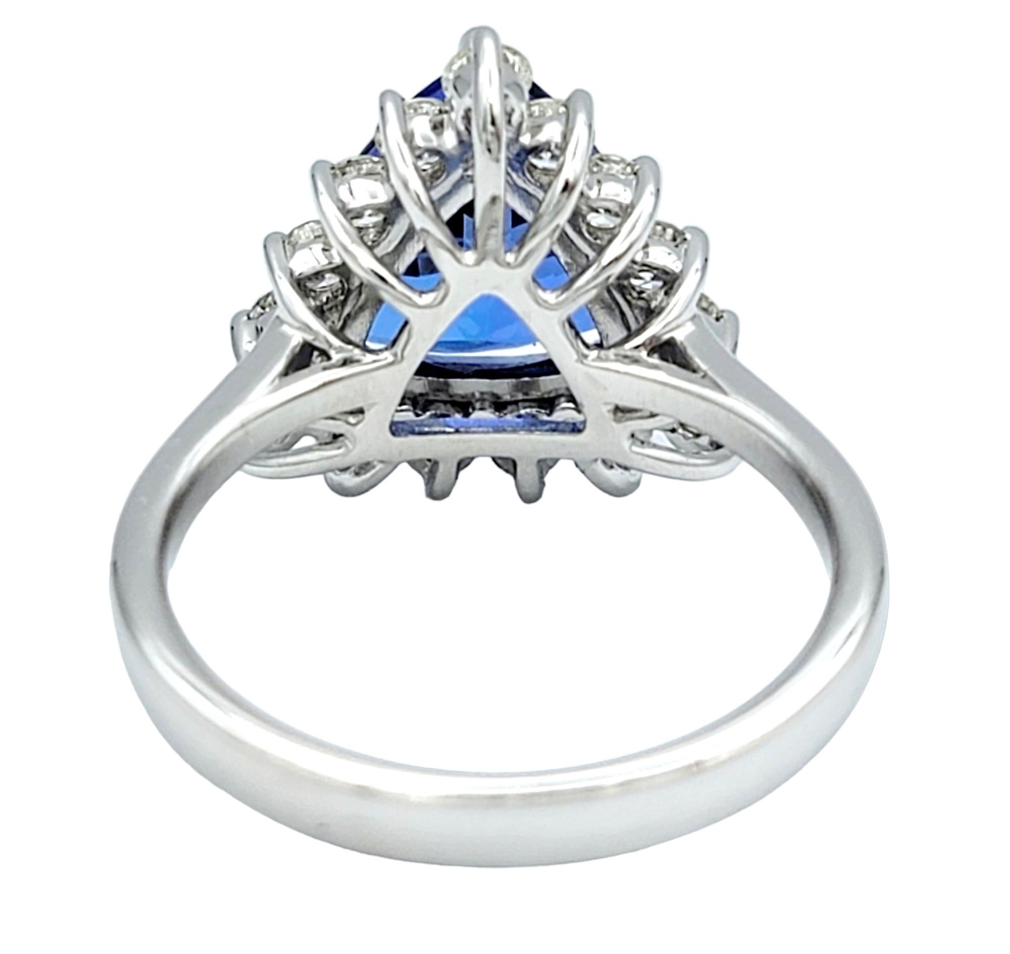 Women's Trillion Cut Blue Tanzanite and Round Diamond Halo Ring in 14 Karat White Gold For Sale