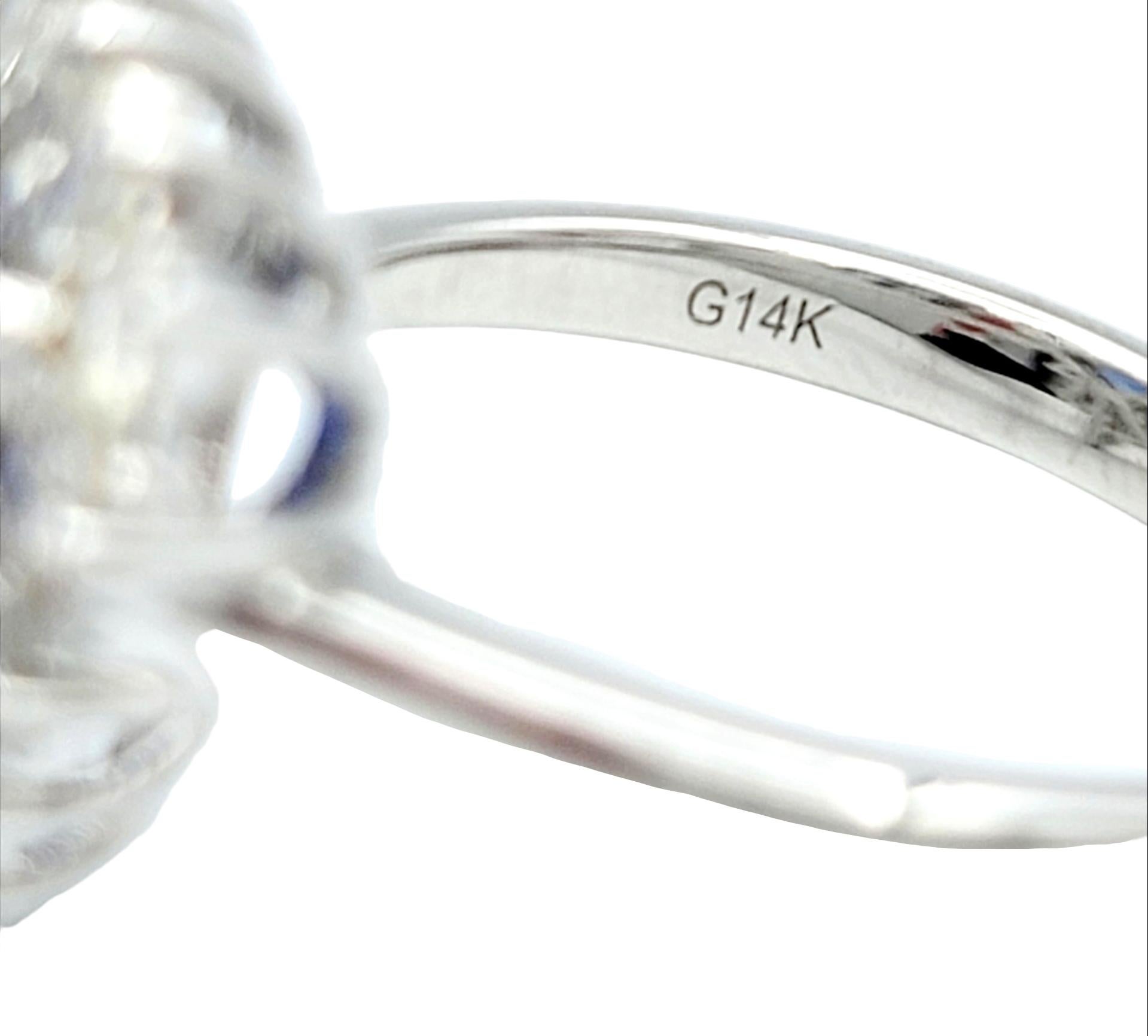 Trillion Cut Blue Tanzanite and Round Diamond Halo Ring in 14 Karat White Gold For Sale 1