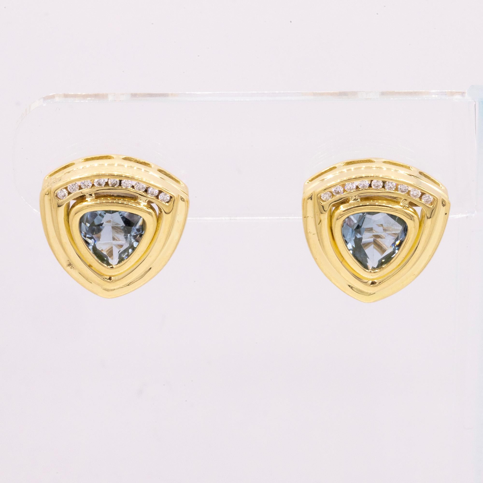 14 Karat Yellow Gold Earrings with Trillion cut Blue Topaz gemstones. Accented with 20 Round Brilliant cut Diamonds. These earrings weigh 7.11 dwt. Fun and easy to wear everyday earrings! 
