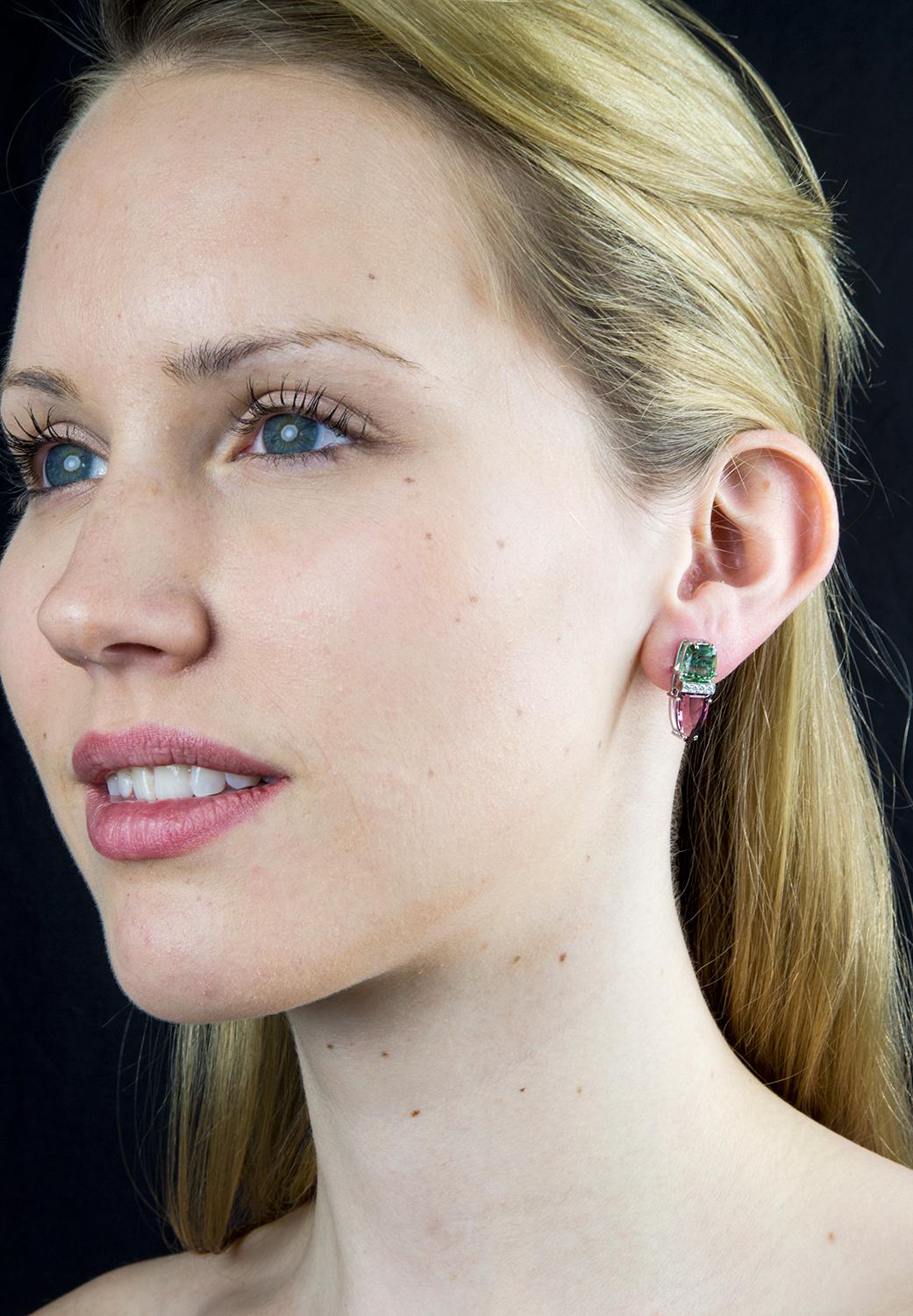 Beautiful pair of Statement Studs earrings, each set with a square-cut Green Tourmaline; 4.96 tctwt and Trillion-Cut Garnet; 6.04 tctwt, inter-spaced with 4 round-cut Diamonds; Hand crafted in 14K White Gold. Chic, Classic and Timeless, taking you