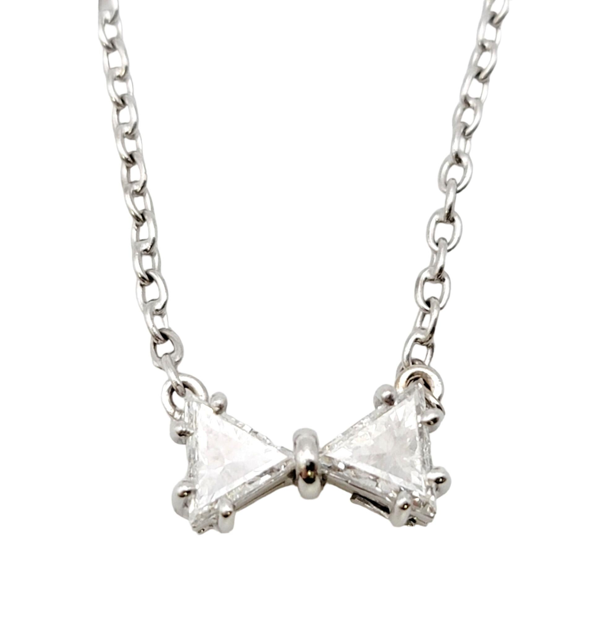 This adorable diamond bowtie pendant necklace is the perfect addition to any look! Dainty, playful and classic, this sparkling necklace will add an understated touch of glitz and glamour to your everyday life.  

Featuring an 18 karat white gold