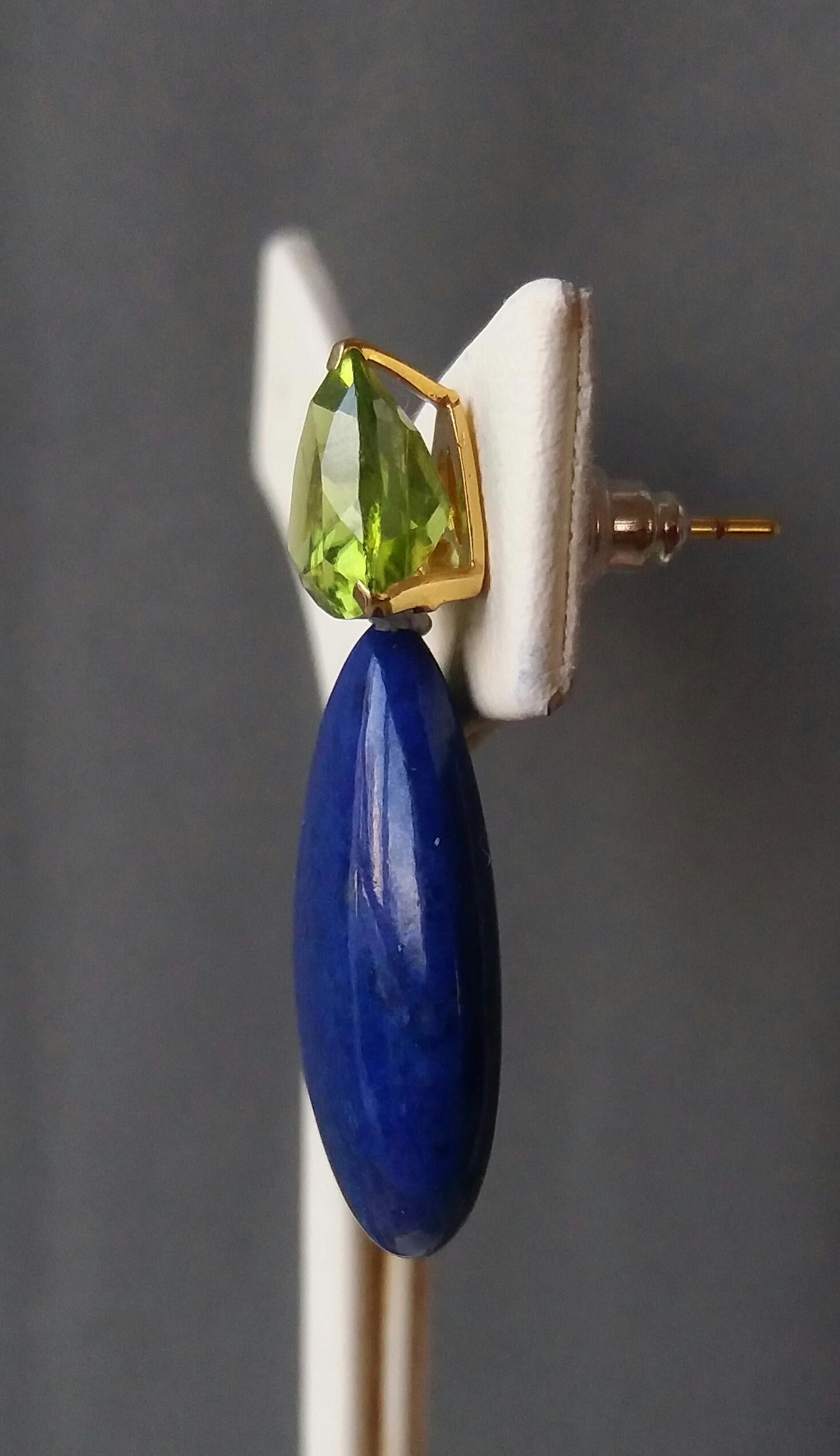 These simple but elegant and unique earrings have 2 faceted Trillion shape Peridots set in yellow gold at the top to which are suspended 2 Lapis Lazuli plain drops size 18 mm x 25 mm

In 1978 our workshop started in Italy to make simple-chic Art