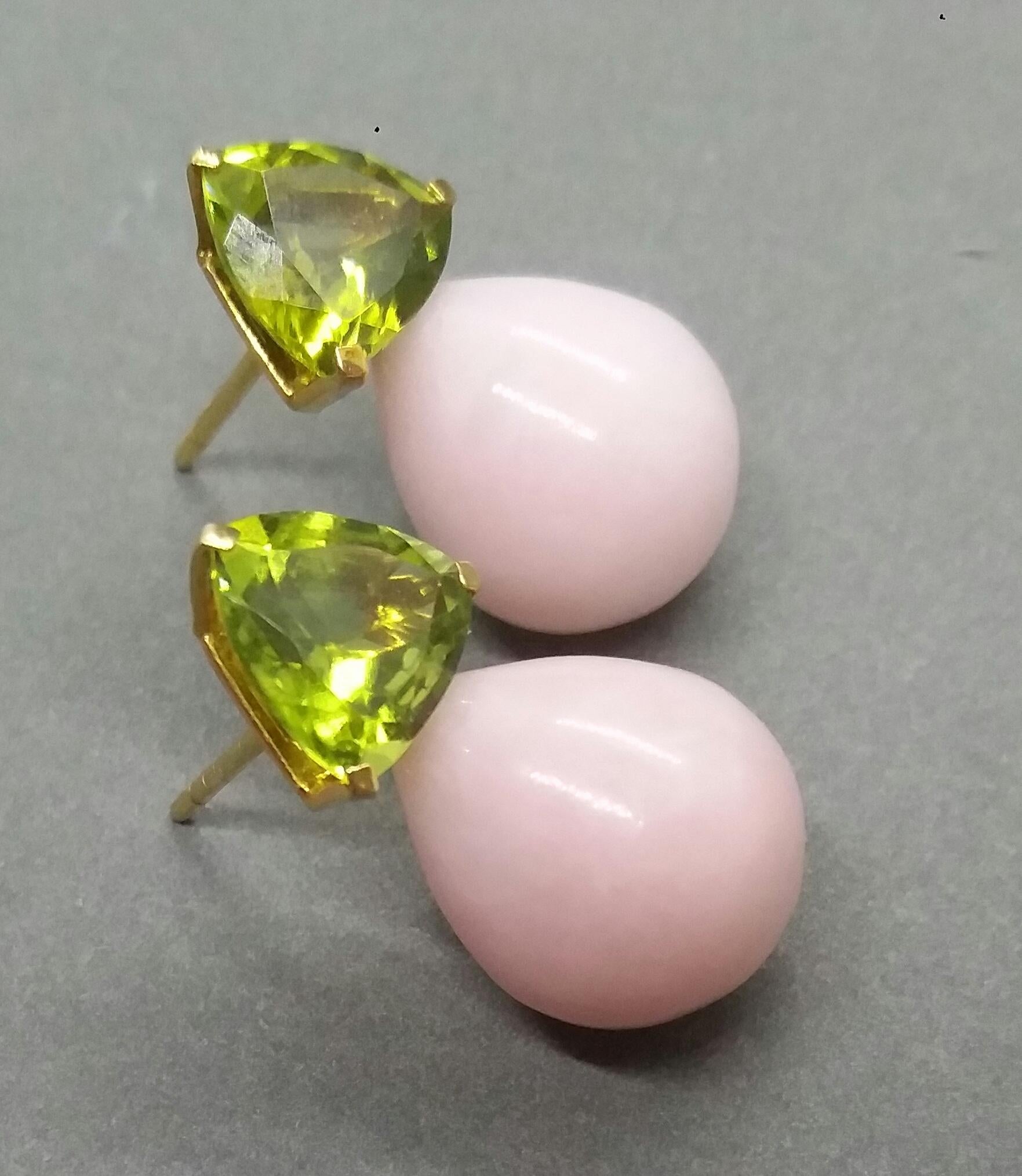 These simple but elegant and unique earrings have 2 faceted Trillion shape Peridots set in yellow gold at the top to which are suspended 2 Pink Opal plain drops size 13 mm x 15 mm

In 1978 our workshop started in Italy to make simple-chic Art Deco