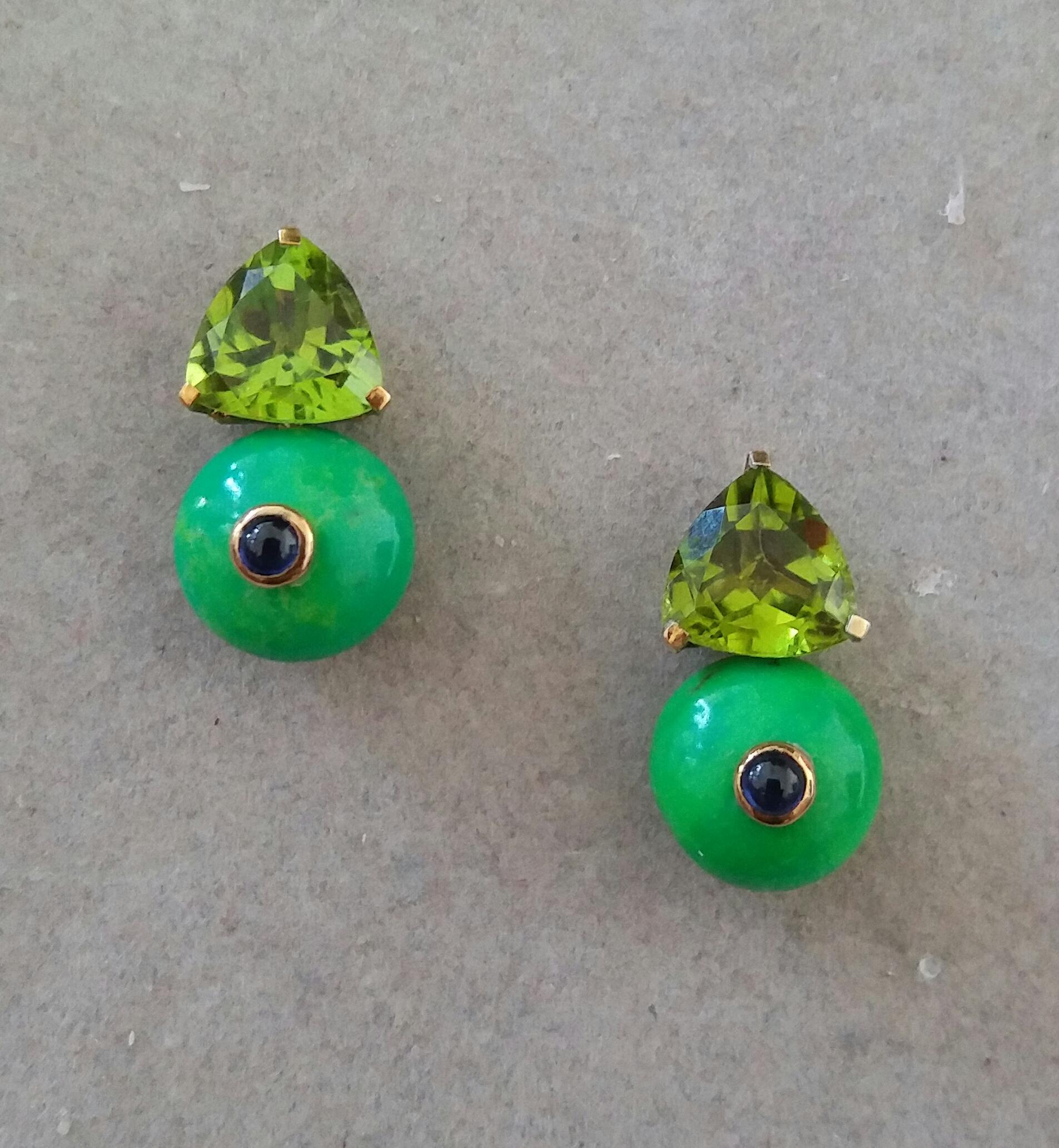 Simple chic stud earrings with a pair of Trillion Cut Peridots measuring 10mm x10 mm set in solid 14 Kt. yellow gold on the top and in the lower parts 2 Turkmenistan Green Turquoise round buttons of 12 mm in diameter,with 2 small 3mm round Blue