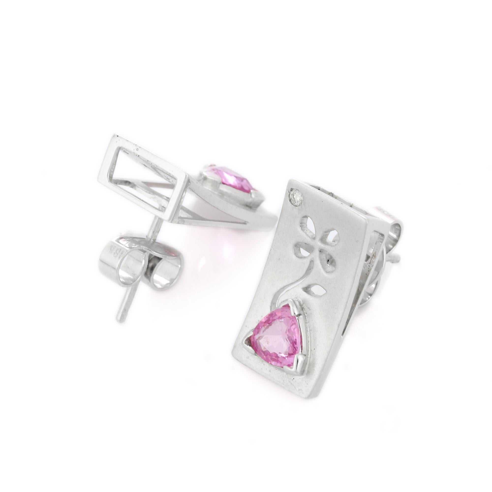 Studs create a subtle beauty while showcasing the colors of the natural precious gemstones and illuminating diamonds making a statement.

Trillion cut pink sapphire studs with diamonds in 18K gold. Embrace your look with these stunning pair of