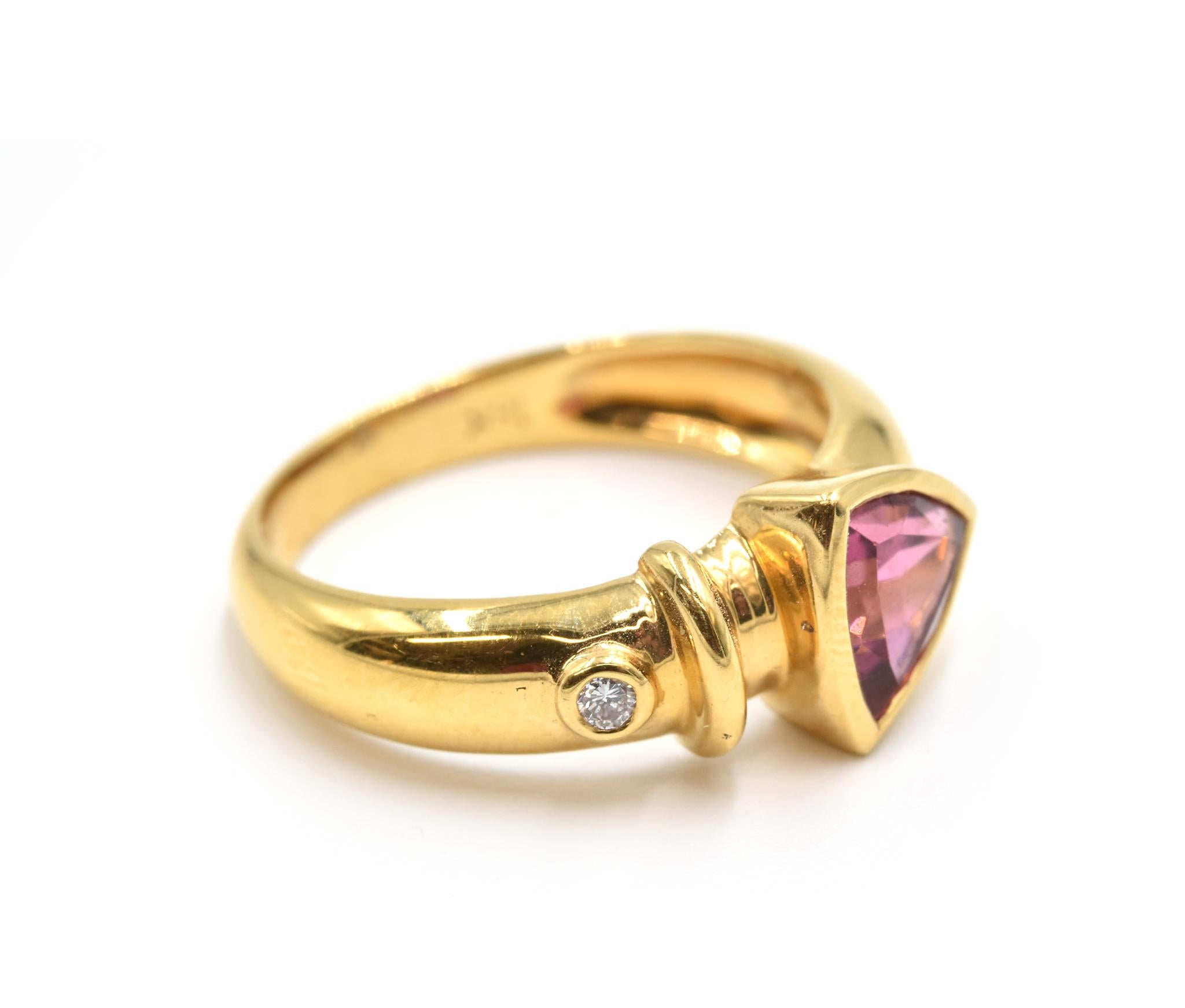 Designer: custom design
Material: 18k yellow gold
Pink Tourmaline: trillion cut 2.00 carat pink tourmaline gemstone
Diamonds: 0.03 carat total weight
Dimensions: ring top measures 1/4-inch long
Ring Size: 6 3/4 (please allow two additional shipping