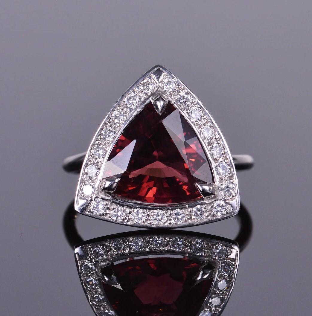 This ring is a fashion statement! The ring is 17 mm x 17mm in size, and it focuses on a natural 5 carat rubellite wrapped with .38cts of brilliant diamonds. This ring was meticulously handmade here in our salon.