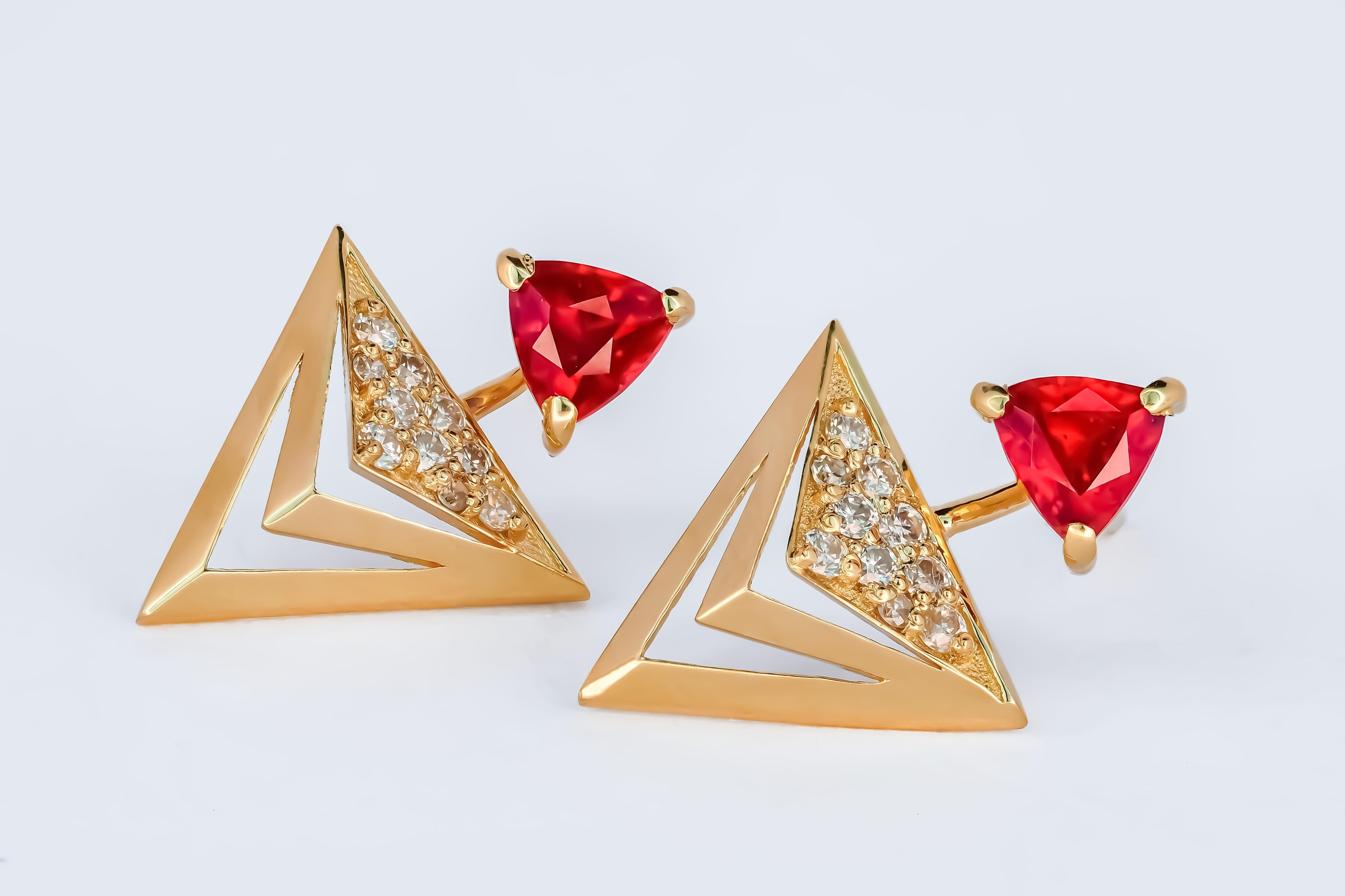 Modern Trillion cut ruby stud earrings in 14k solid gold.  For Sale