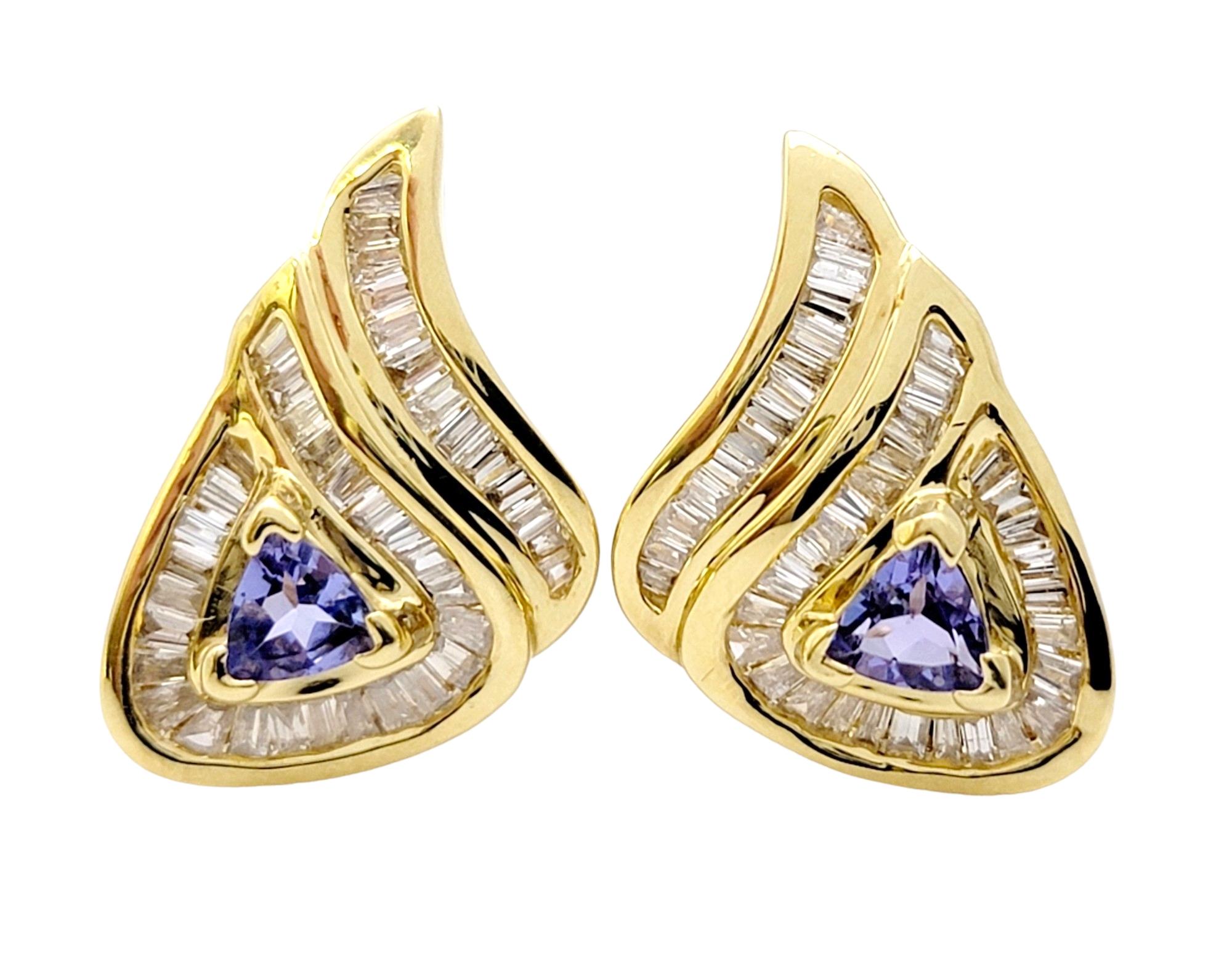 These dazzling, contemporary tanzanite and diamond teardrop earrings absolutely radiate on the ear. Exuding opulence and sophistication, they make a stunning addition to any jewelry lovers collection.

Each earring features a mesmerizing trillion