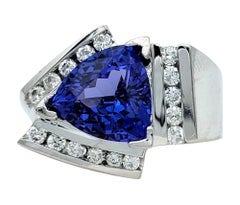 Contemporary Trillion Cut Tanzanite Cocktail Ring with Diamonds in 14 Karat Gold