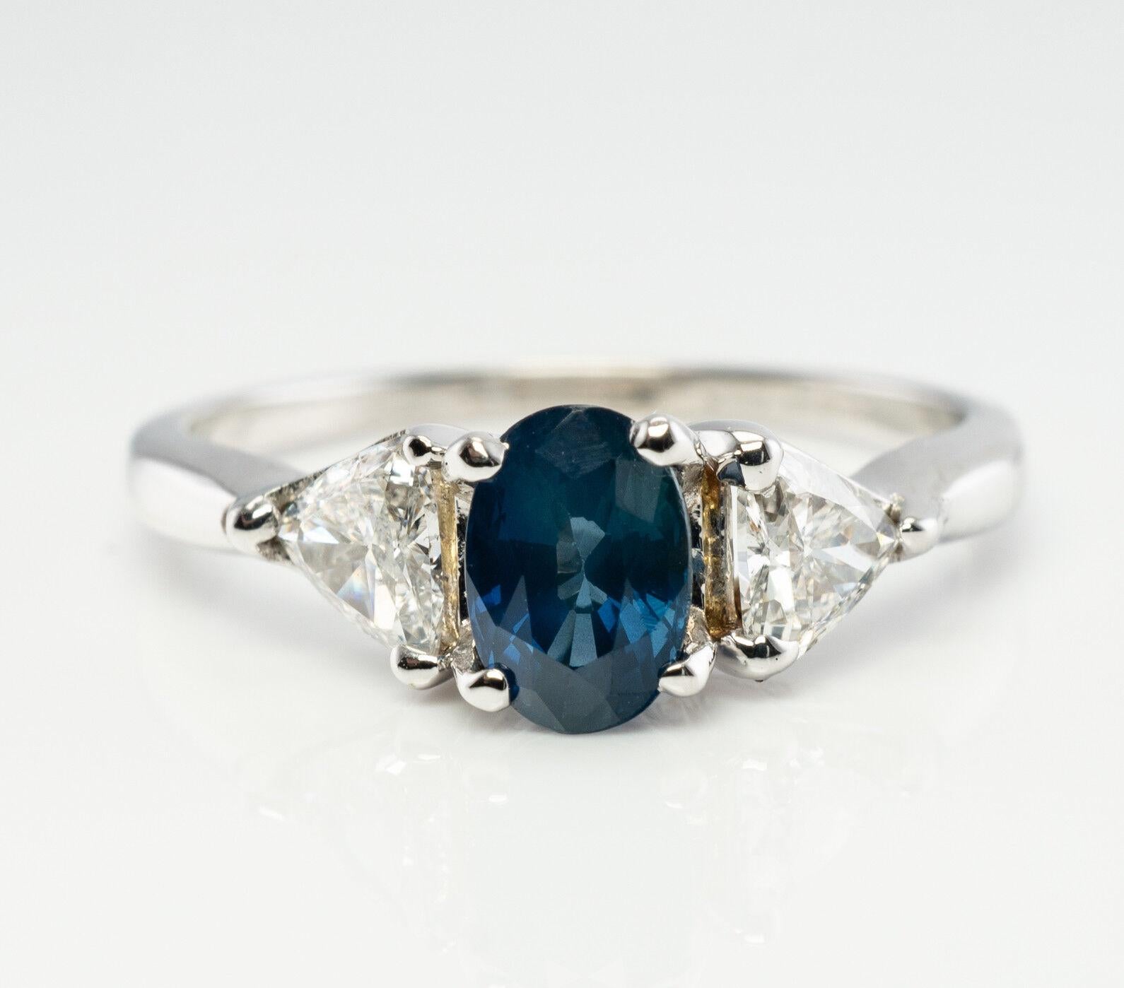 This beautiful estate ring is finely crafted in solid 14K White Gold (carefully tested and guaranteed), and set with genuine Earth mined Sapphire and trillion cut diamonds. The center gem measures 6mm x 4mm (.60 carat). Two trillion cut diamonds