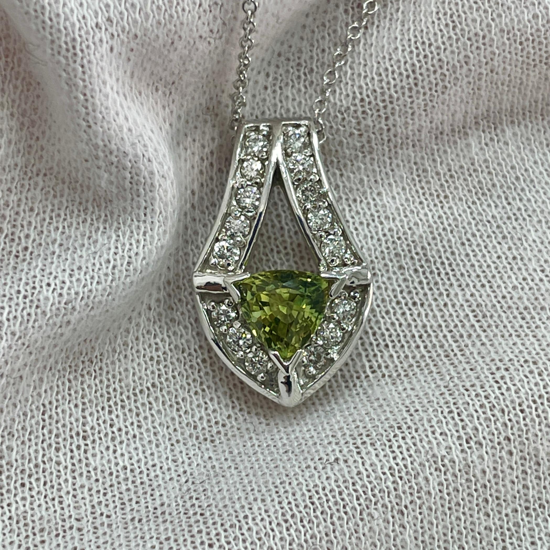A green 1.01Ct sapphire in a diamond (0.36Ct) 14K white gold pendant