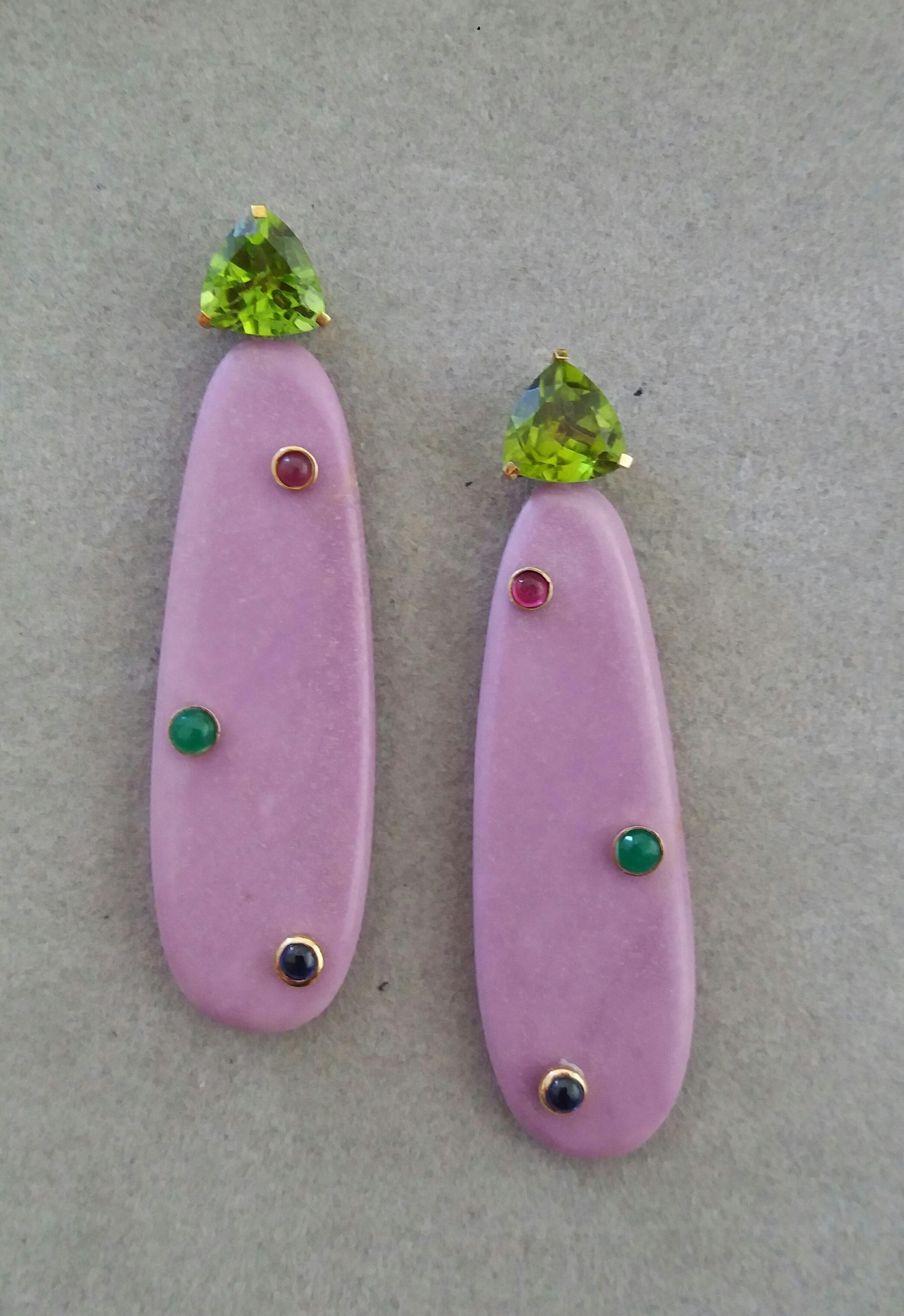 Unique earrings with a pair of Trillion cut Peridot size 10 x 10 mm set in 14 kt solid yellow gold on the top and a lower part with 6 small round ruby,blue sapphire and emerald cabochons set in 2 Phosphosiderite flat drops measuring 18 x 55 mm. 

In
