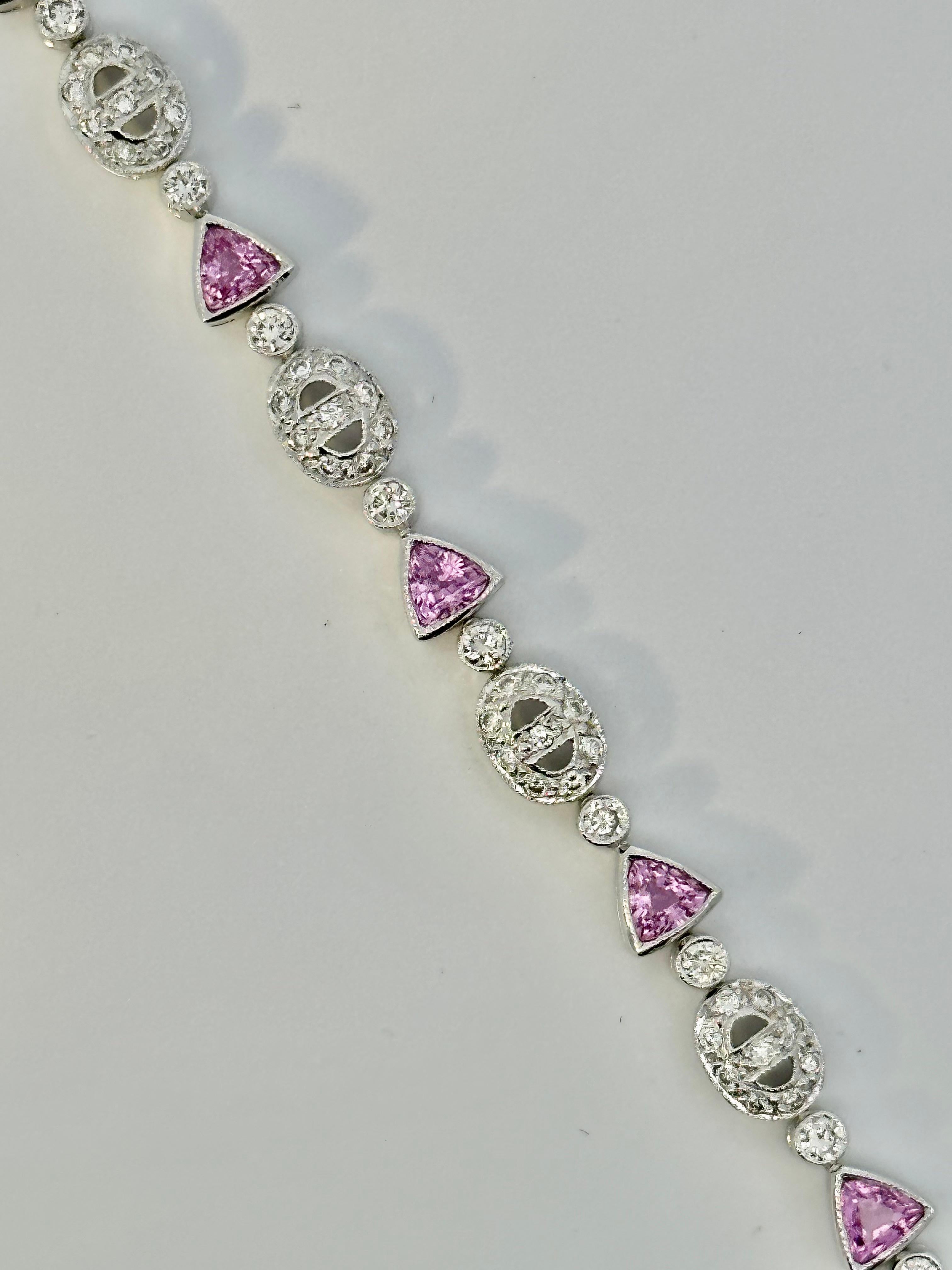 One 18kt white gold bracelet set with trillion cut natural pink sapphires and brilliant cut diamonds. Perfect for everyday with a little splash of colour. 

11 trillion cut natural pink sapphires weighing 2.75ct total weight

120 brilliant cut