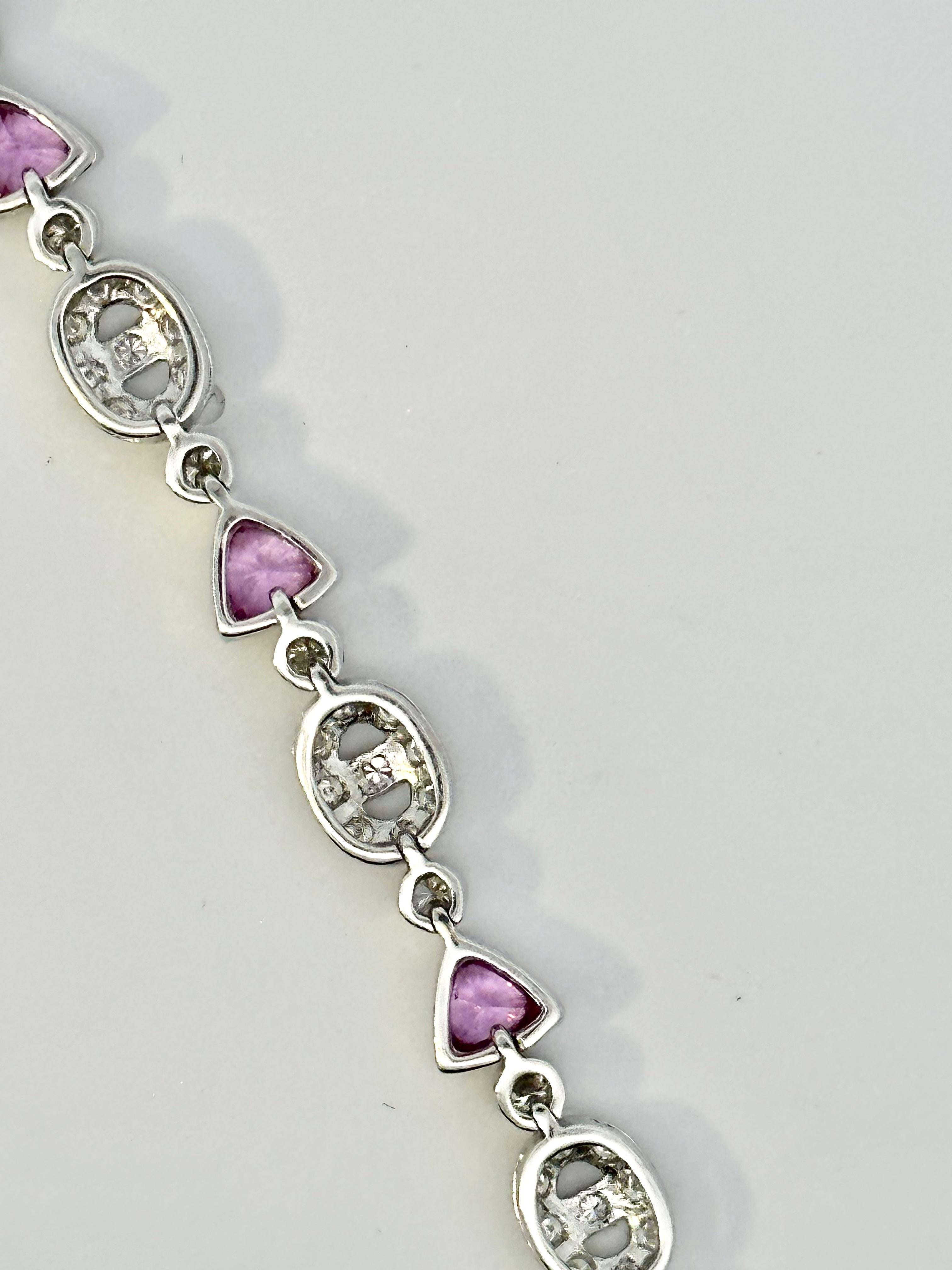Contemporary Trillion Pink Sapphire and Oval Motif Diamond Bracelet on 18 Karat White Gold For Sale