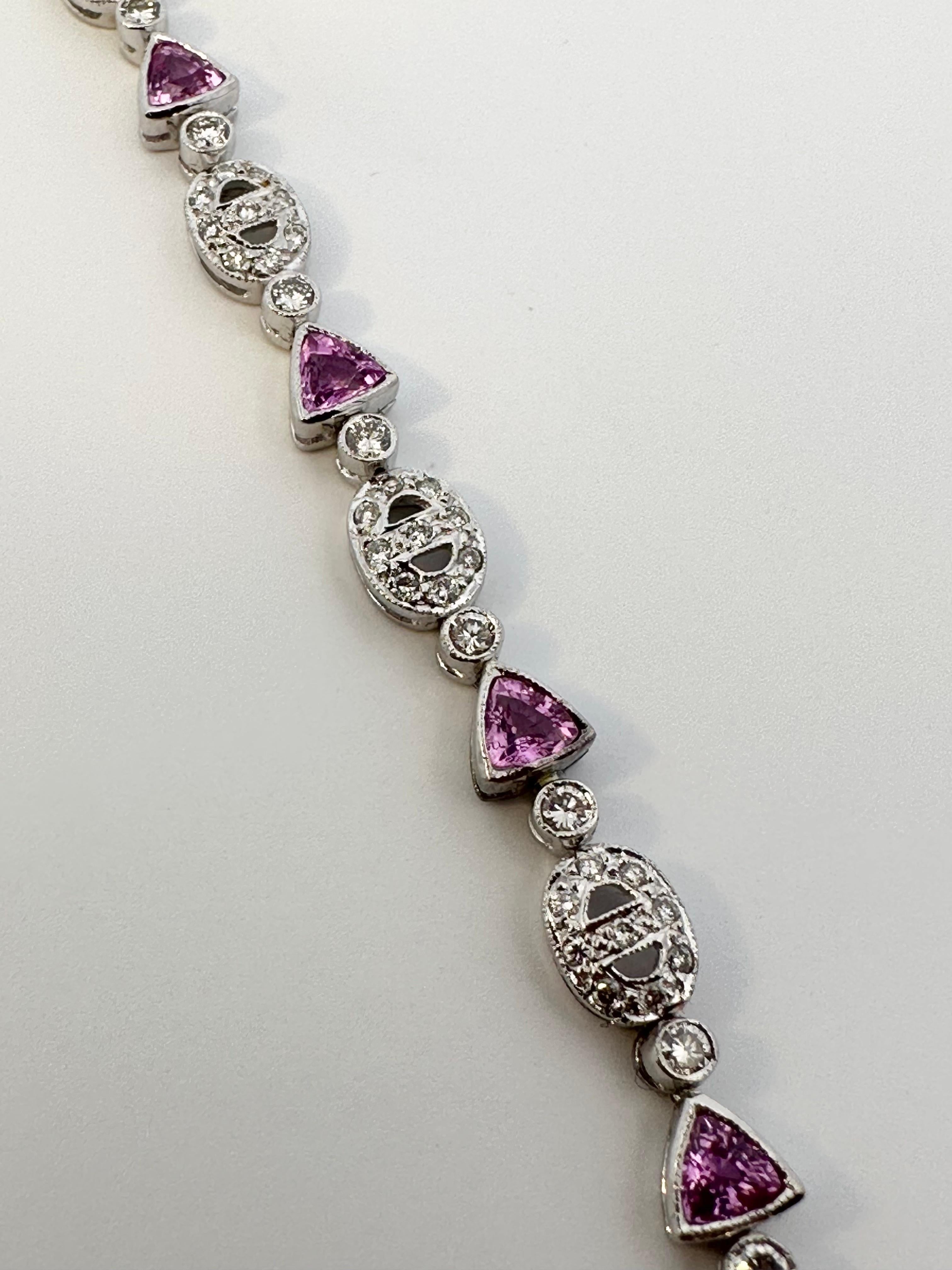 Women's Trillion Pink Sapphire and Oval Motif Diamond Bracelet on 18 Karat White Gold For Sale
